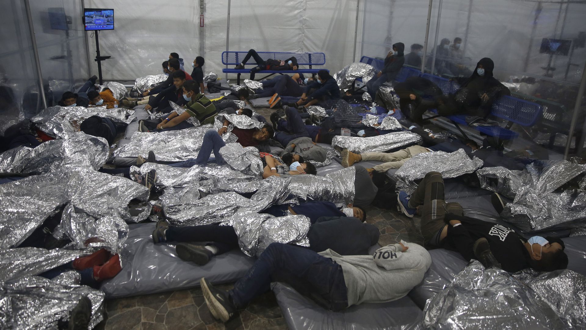 Picture of an overcrowded tent in a border facility in Donna, Texas