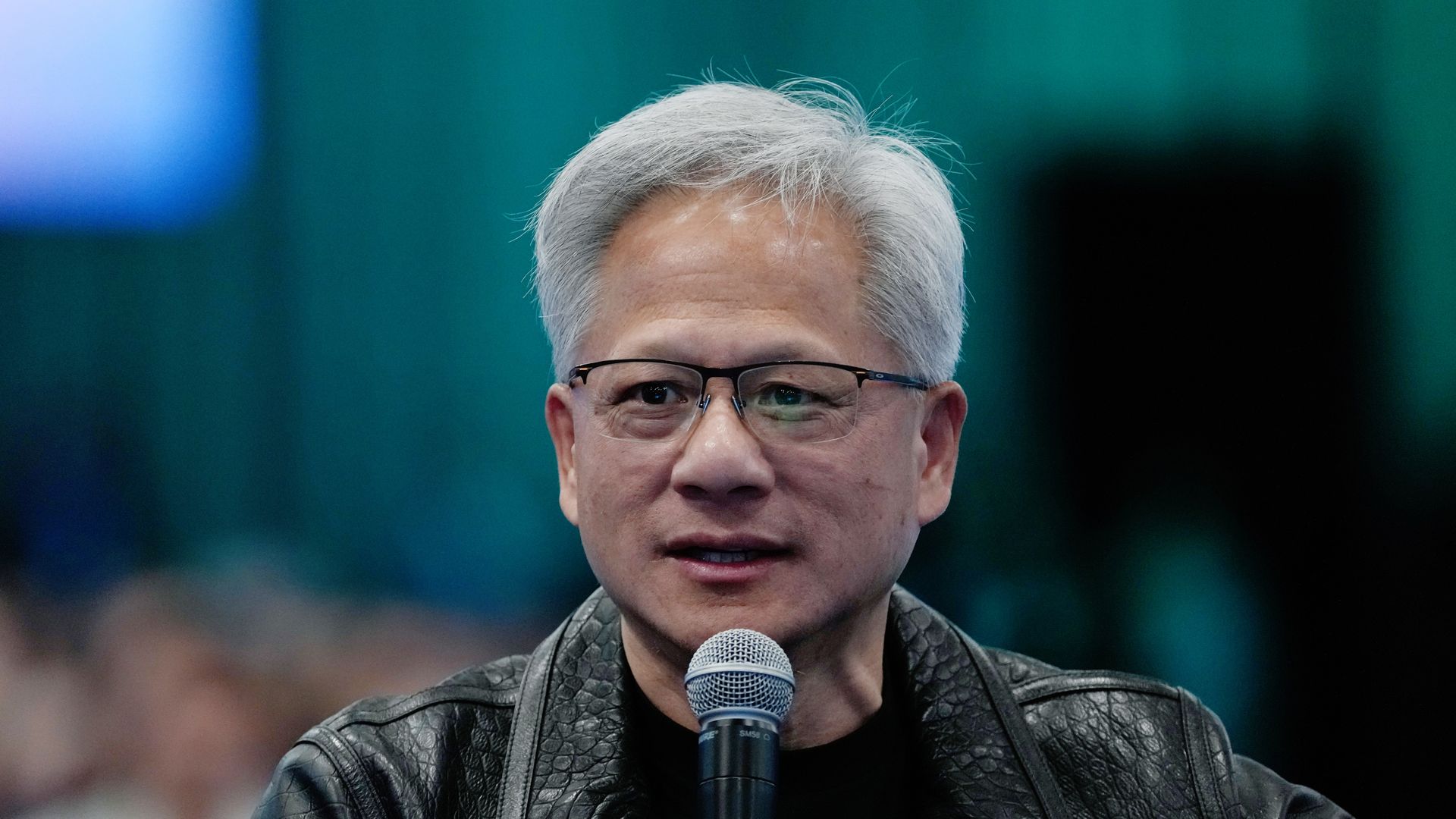 Nvidia CEO Jensen Huang speaks onstage at Salesforce's Dreamforce conference in San Francisco.