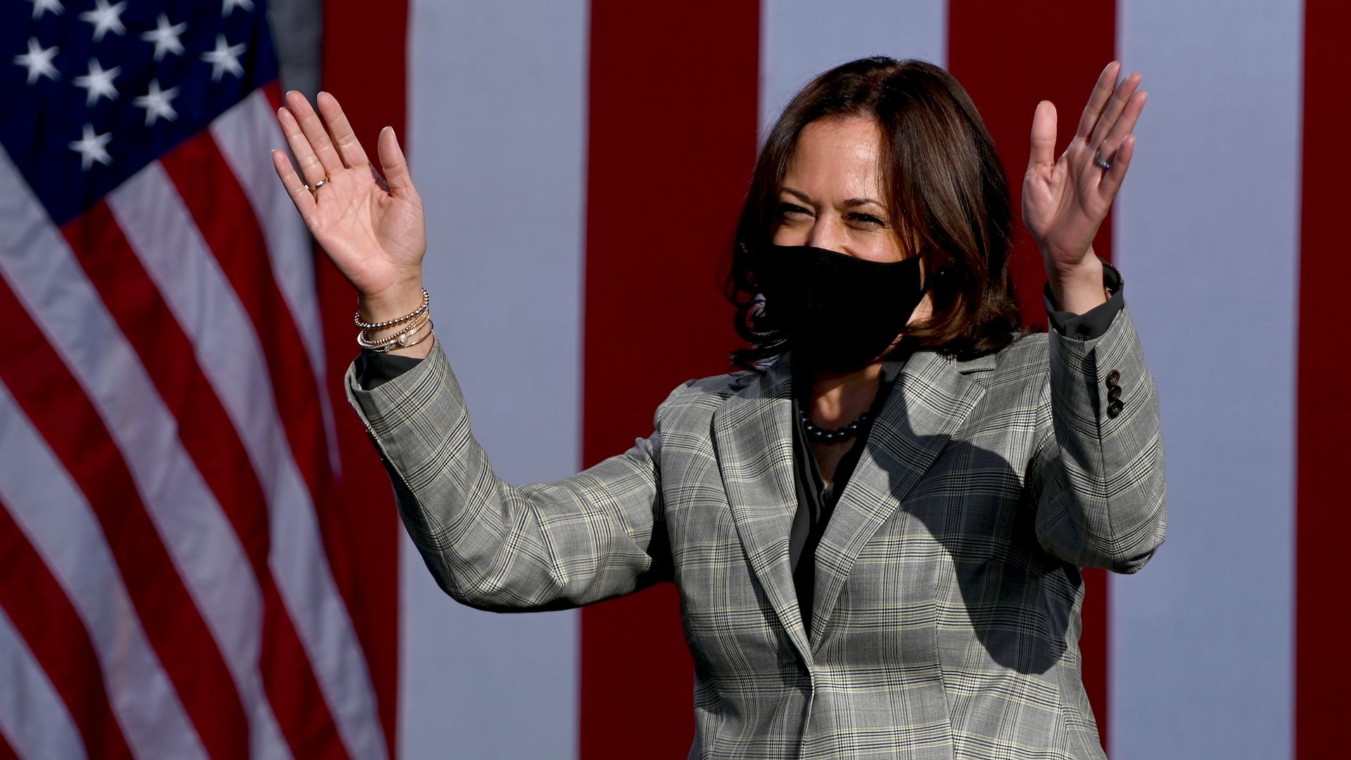 Democratic U.S. Vice Presidential nominee Sen. Kamala Harris (D-CA) waves as she arrives at a voter mobilization drive-in event in Las Vegas. 