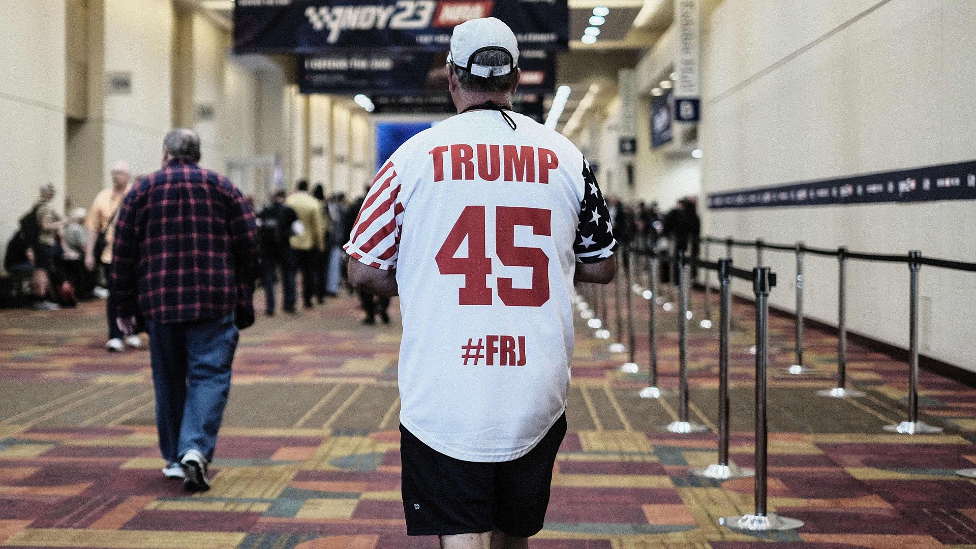 A man wears a Trump jersey at the NRA convention.