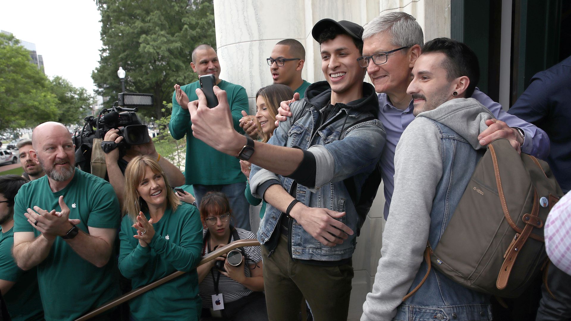 Three men take a selfie together