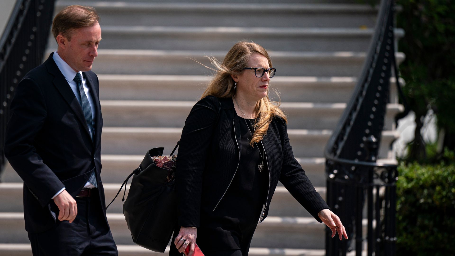 Jen O'Malley Dillon, White House deputy chief of staff, and Jake Sullivan leaving the White House.