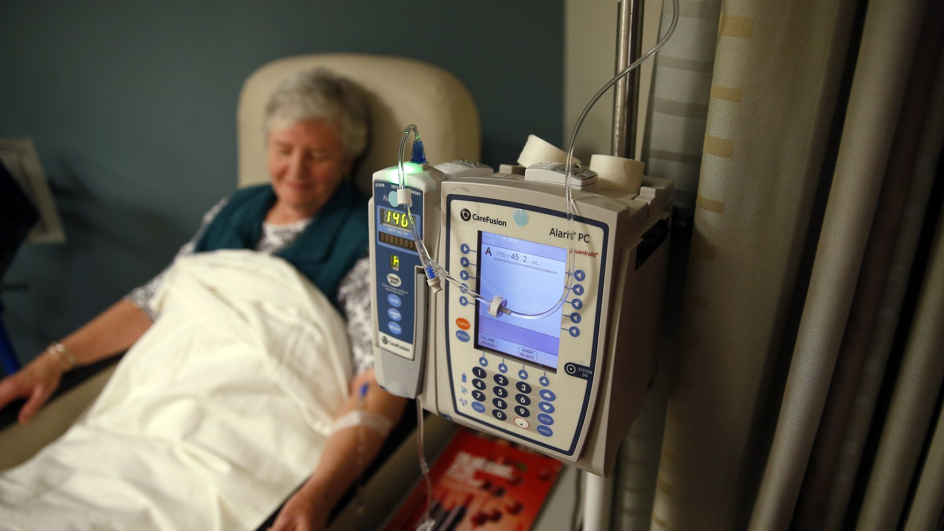 A patient gets her medication intravenously at a hospital.