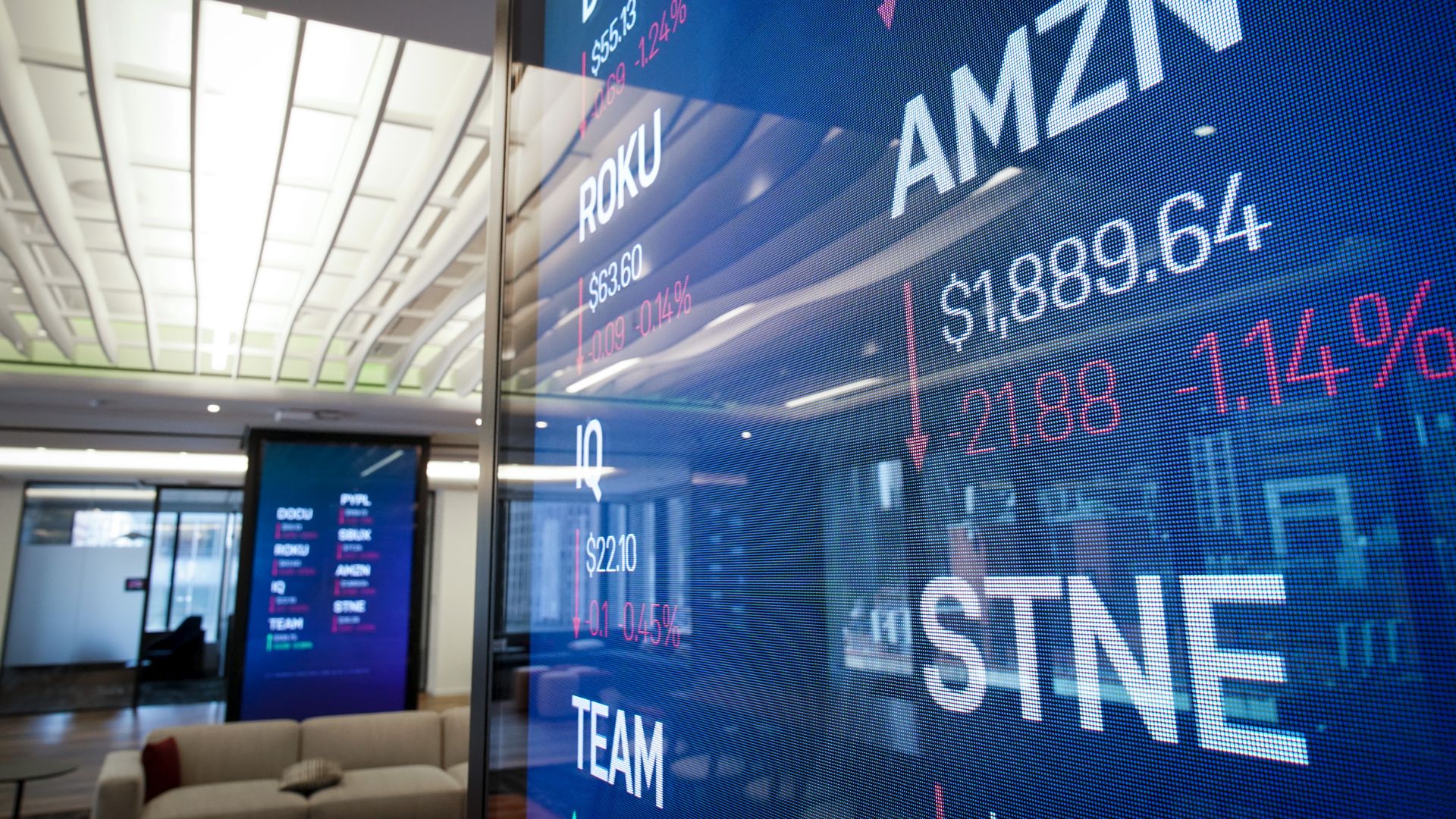 MAY 2: Stock information about Amazon is displayed on a monitor inside Nasdaq's new 'Client Experience Center' at their office in Times Square.