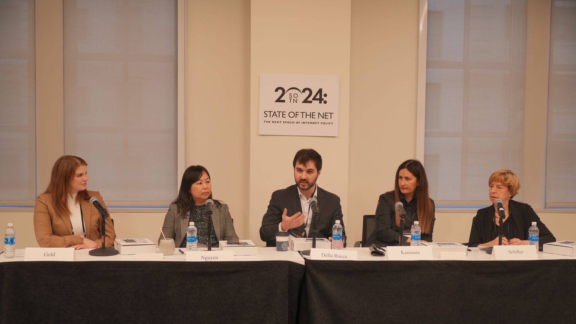 Panelists sat at a long table