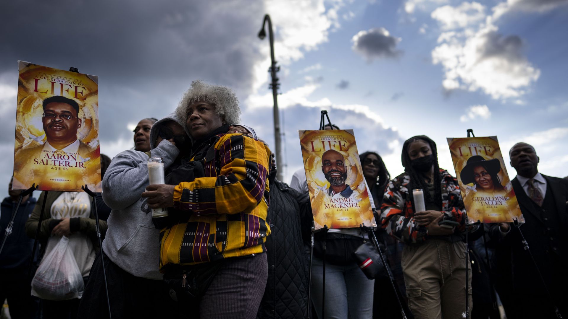 Drea DNur, and Cariol Horne attend a vigil across the street from Tops Friendly Market in Buffalo. 