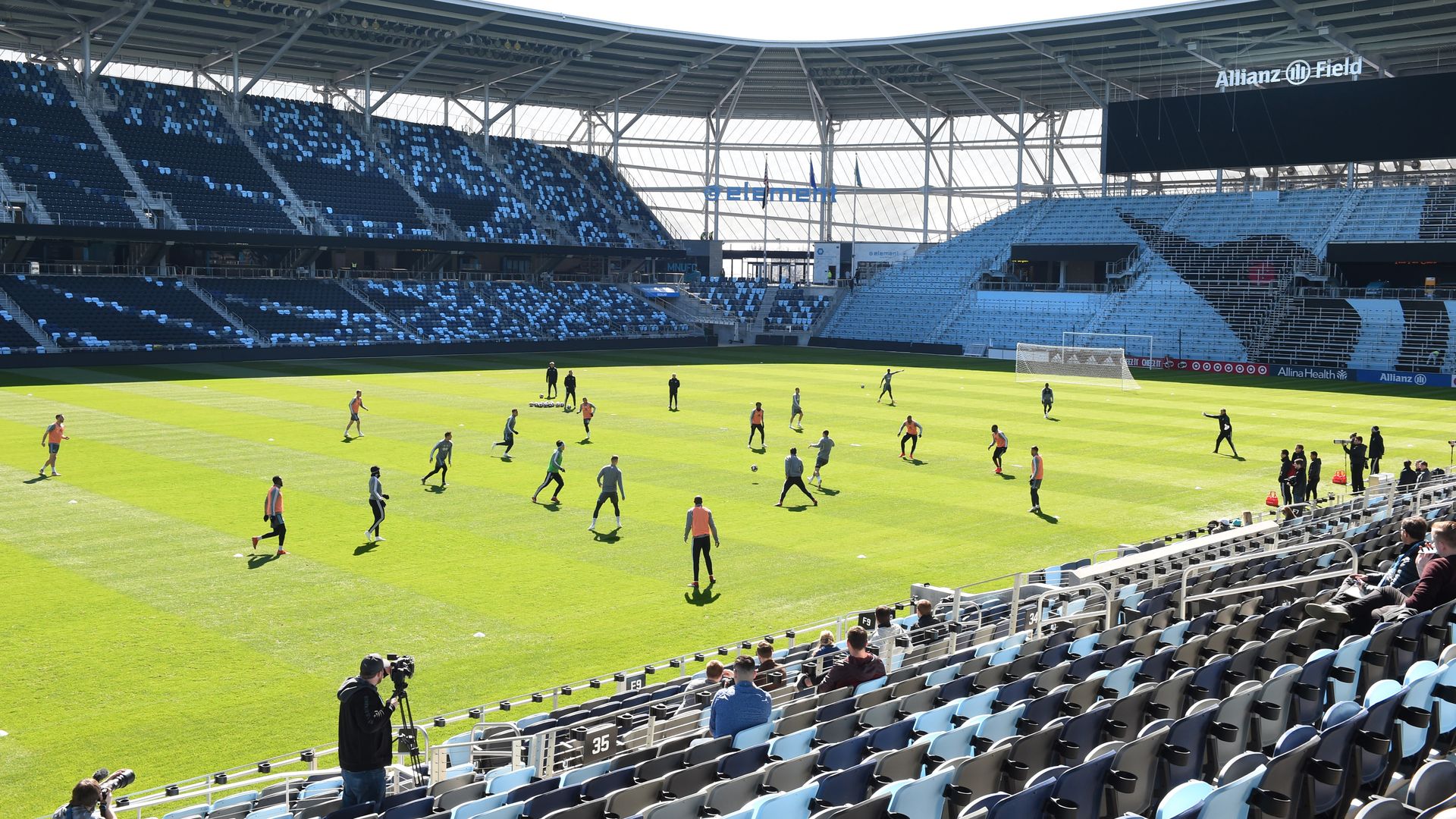 The Allianz field soccer pitch with players on green grass