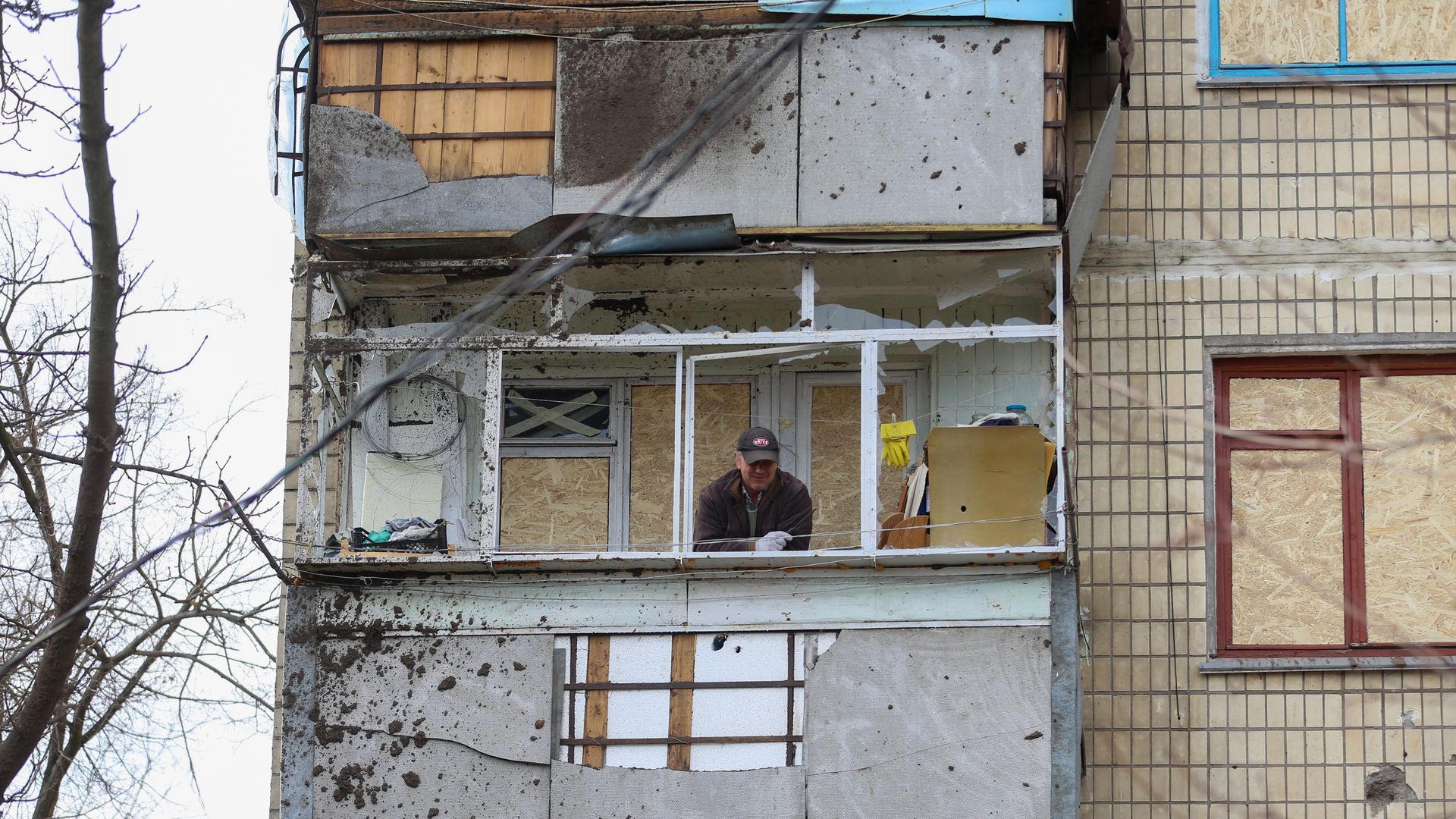 A man repairs his house damaged Russian attack as the war between Russia and Ukraine continues in Nikopol, Ukraine on March 03, 2023.