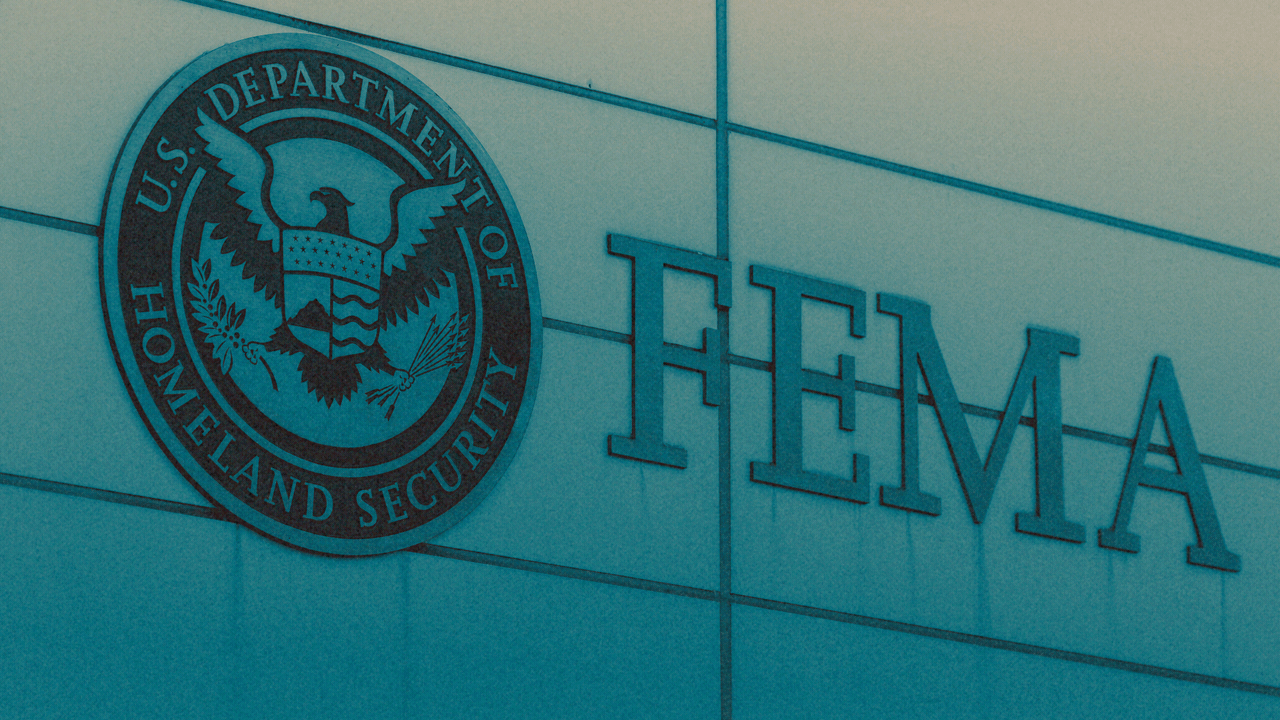 Animated photo illustration of three markers hitting and sticking out of the side of FEMA headquarters.