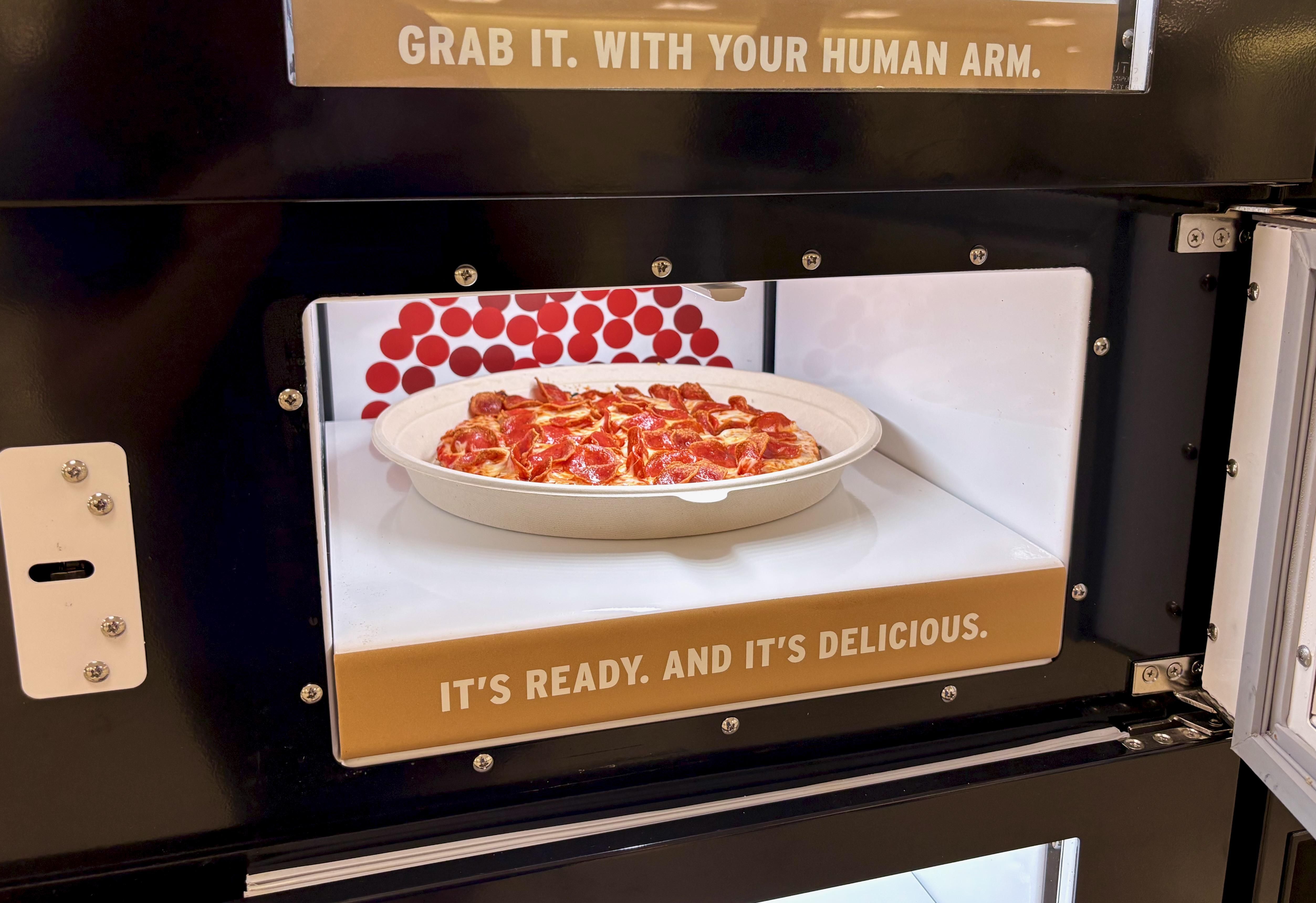 A 10-inch pepperoni pizza inside the pickup area of the fully autonomous, robot-staffed Donatos inside the Columbus airport.