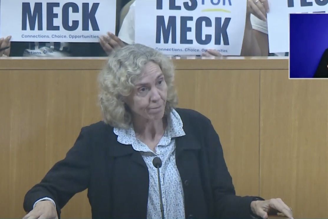 Roberts speaking at a podium