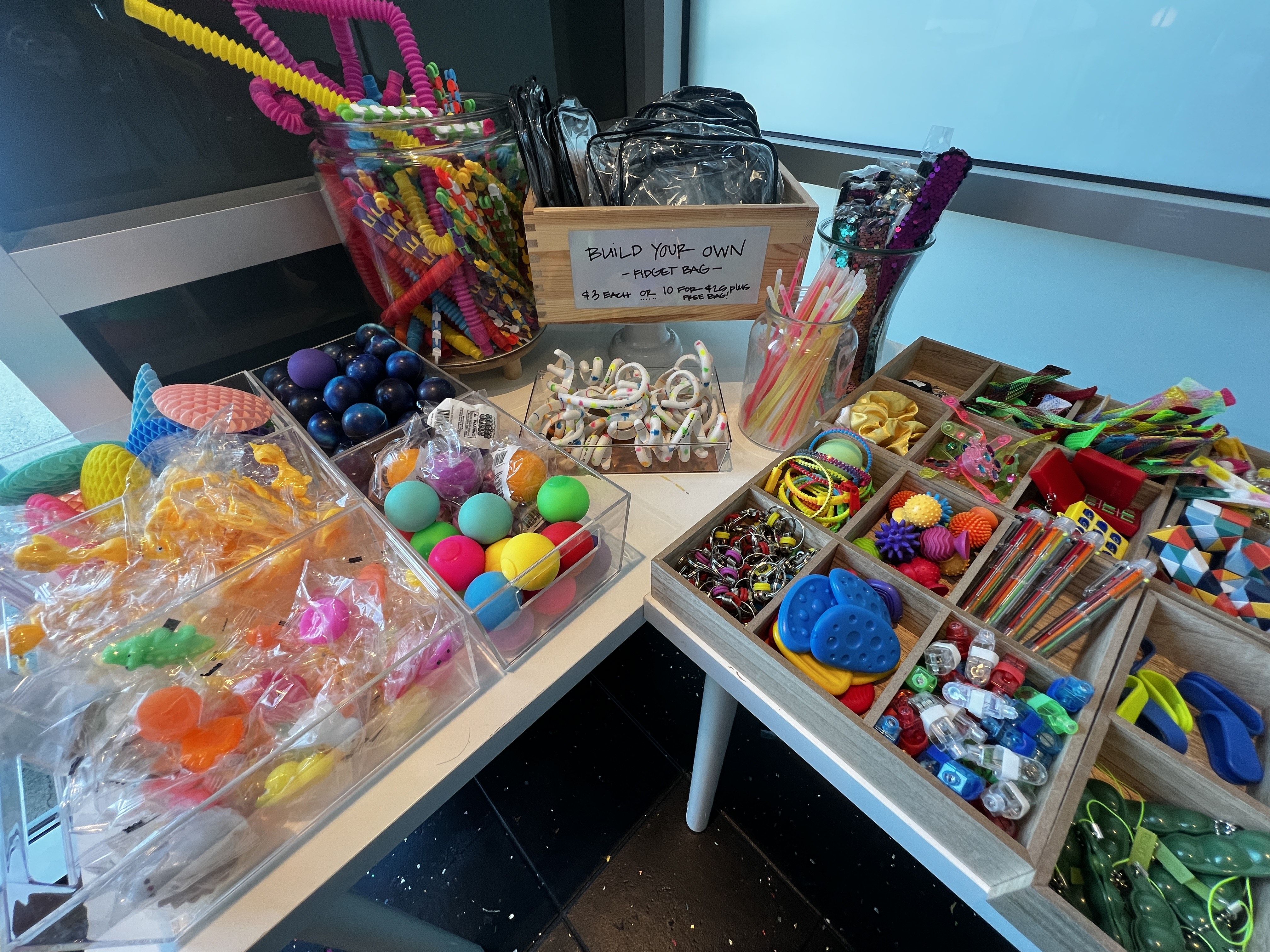 a bunch of little toys for a make your own fidget bag