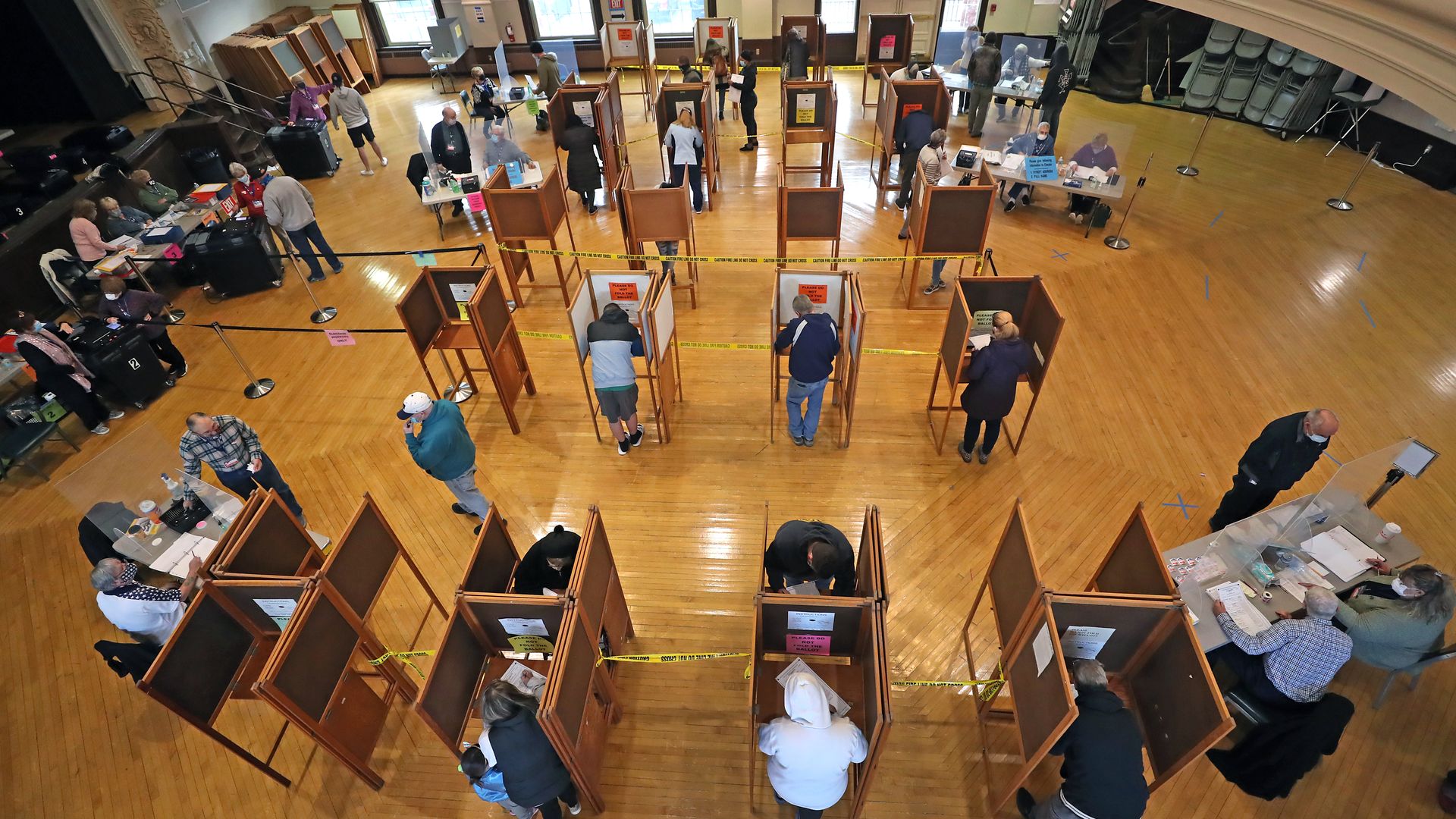 Voters practice social distancing while voting