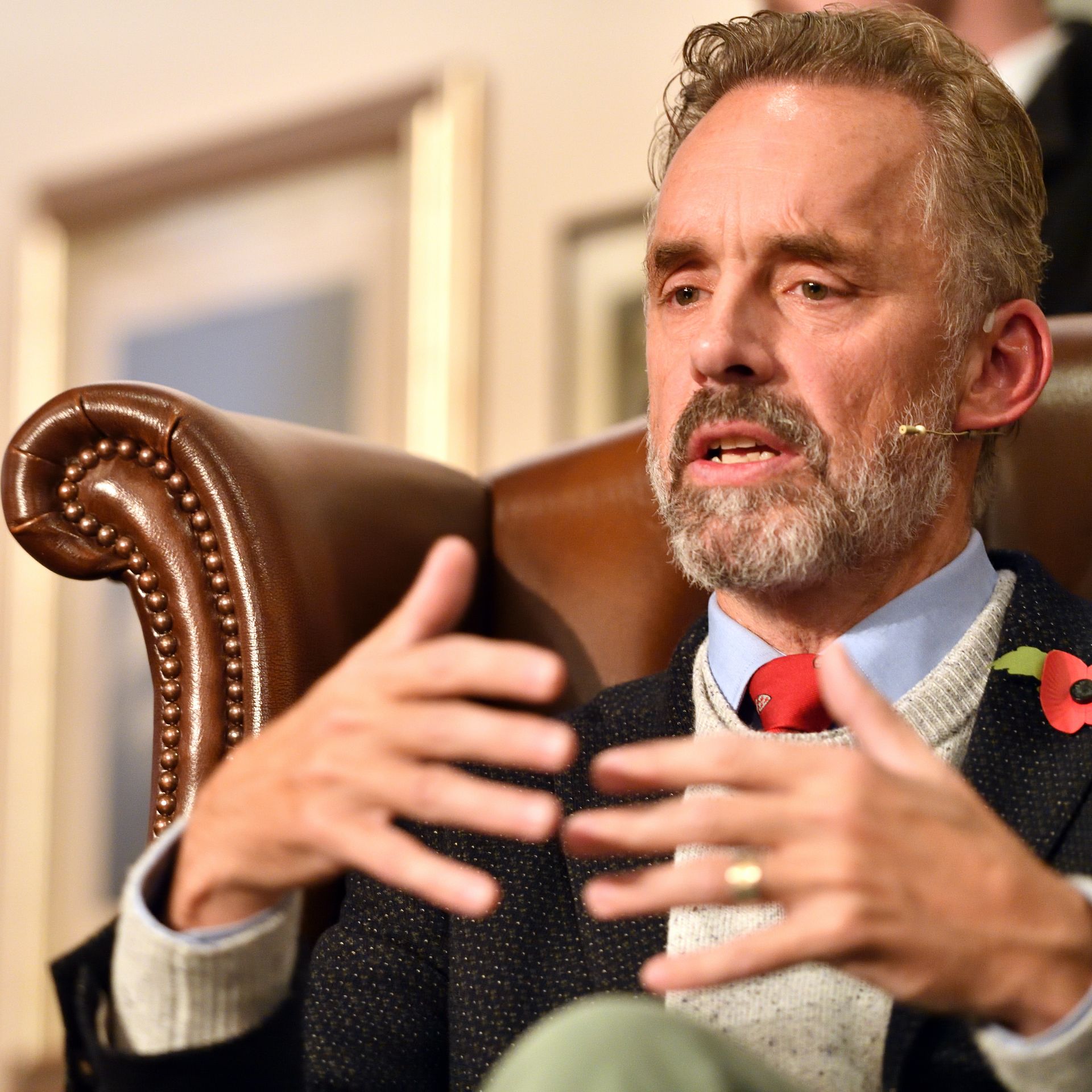 A photo of Jordan Peterson sitting in a chair