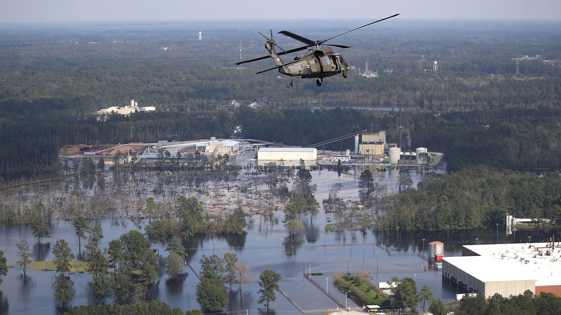 Hurricane Florence flooding: A U.S. Army helicopter flies over homes and businesses flooded by heavy rains from Hurricane Florence on September 20, 2018 in Lumberton, North Carolina.