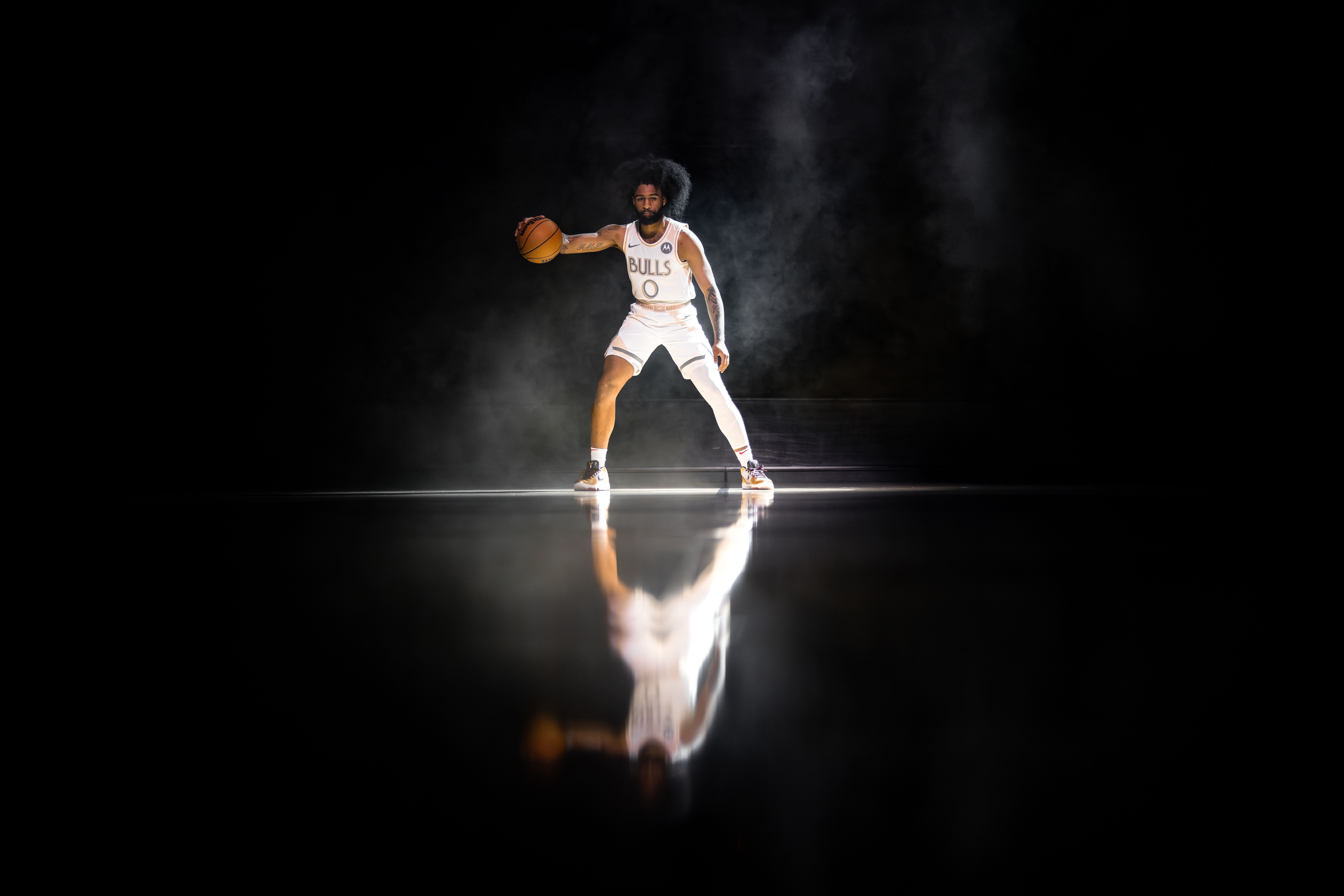 Photo of a basketball player dribbling a ball 