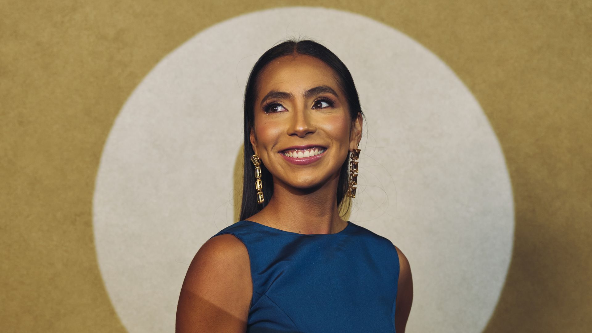 Mexican flag football star Diana Flores poses with a spotlight on her upper body