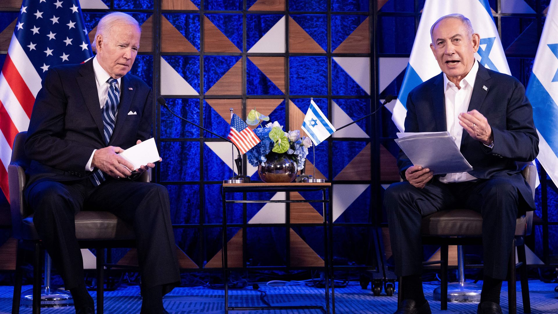 US President Joe Biden listens to Israel's Prime Minister Benjamin Netanyahu as he reads a statement in Tel Aviv on October 18, 2023. (Photo by BRENDAN SMIALOWSKI/AFP via Getty Images)