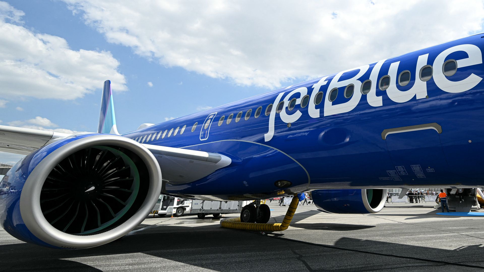 A blue jet on a tarmac