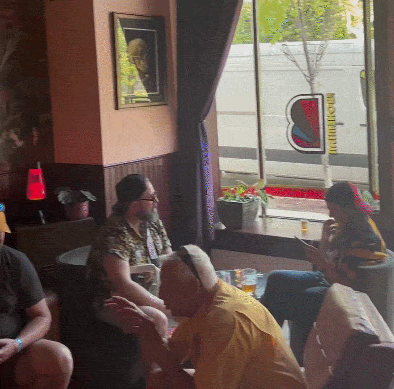 A rotating shot of the inside of a new bar with retro signs and colorful walls