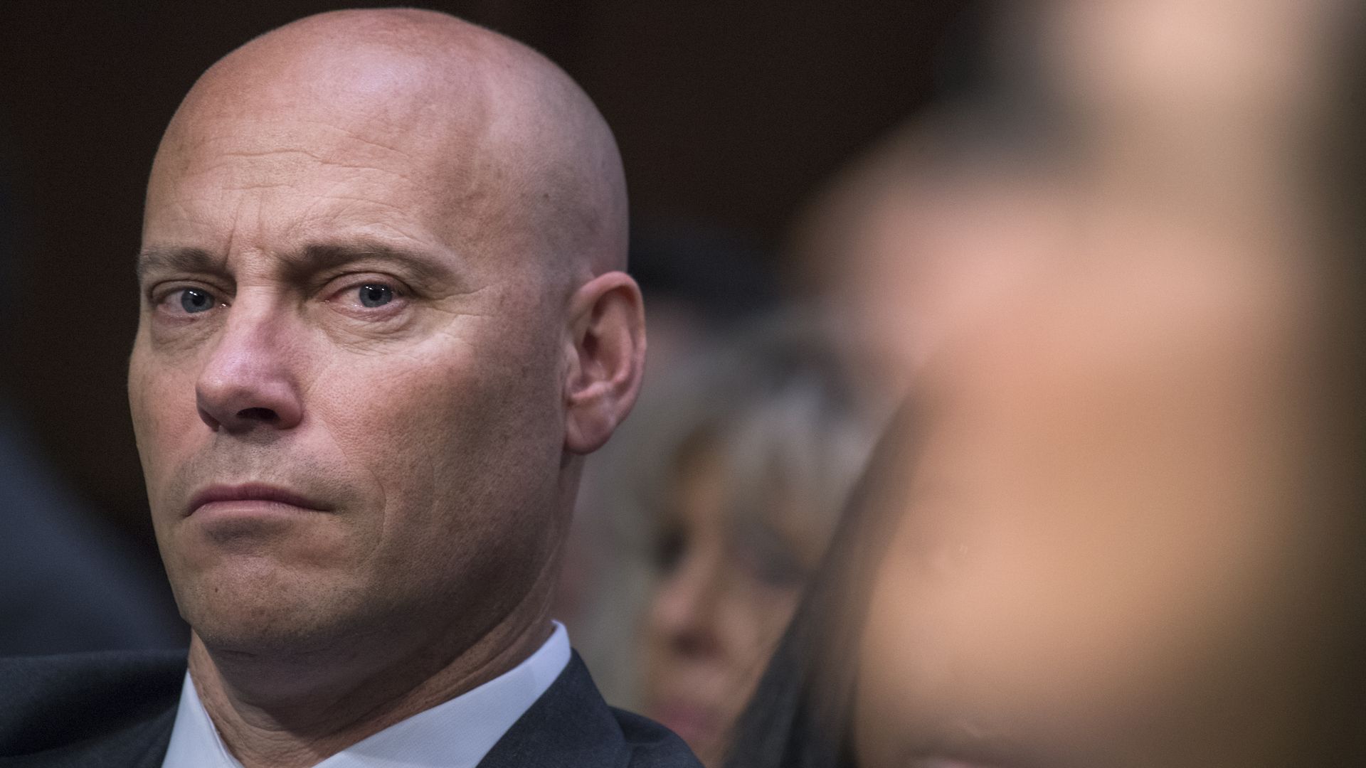 Closeup shot of Marc Short staring at the camera looking unhappy