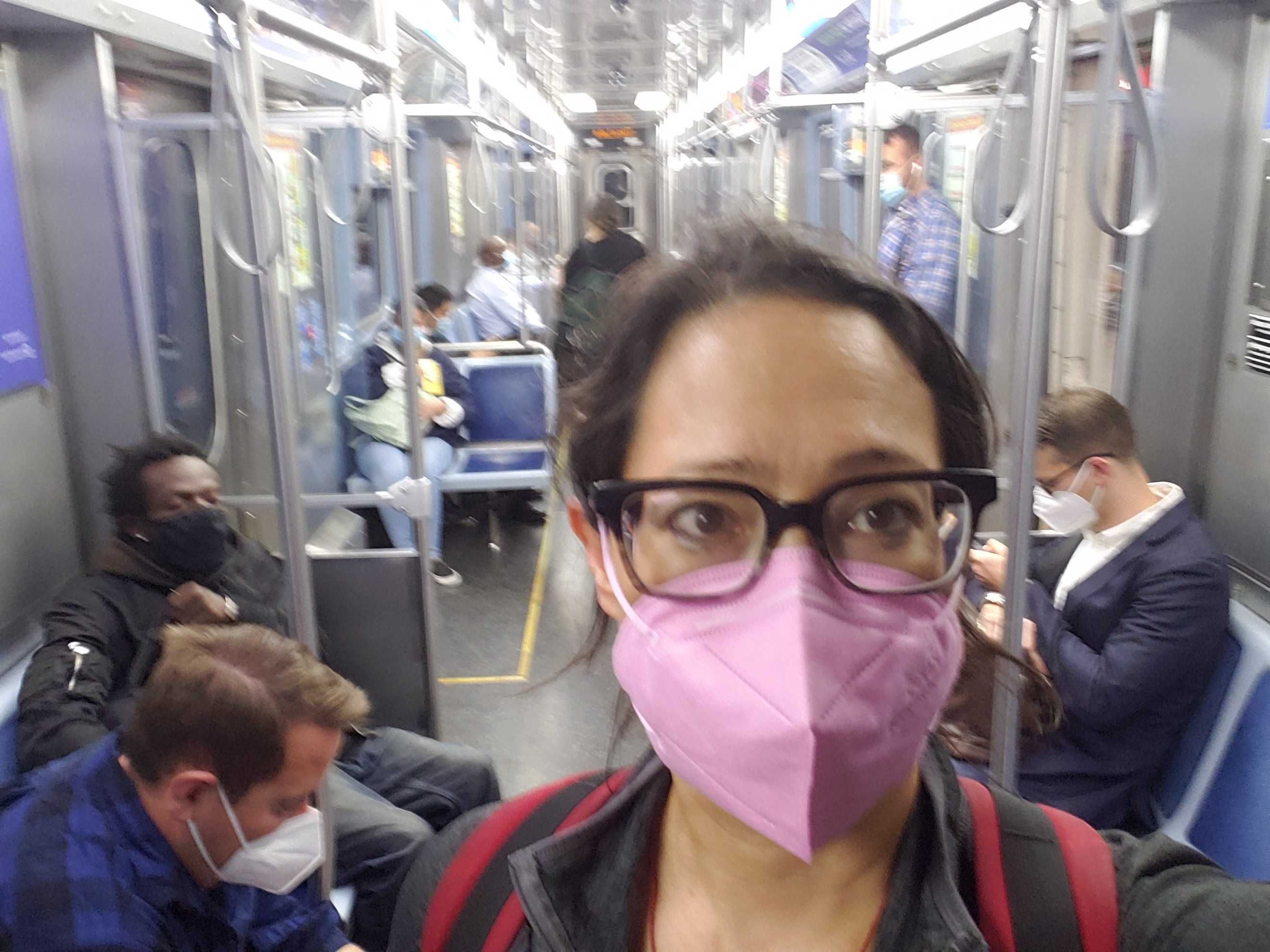 Woman with mask on in a train. 