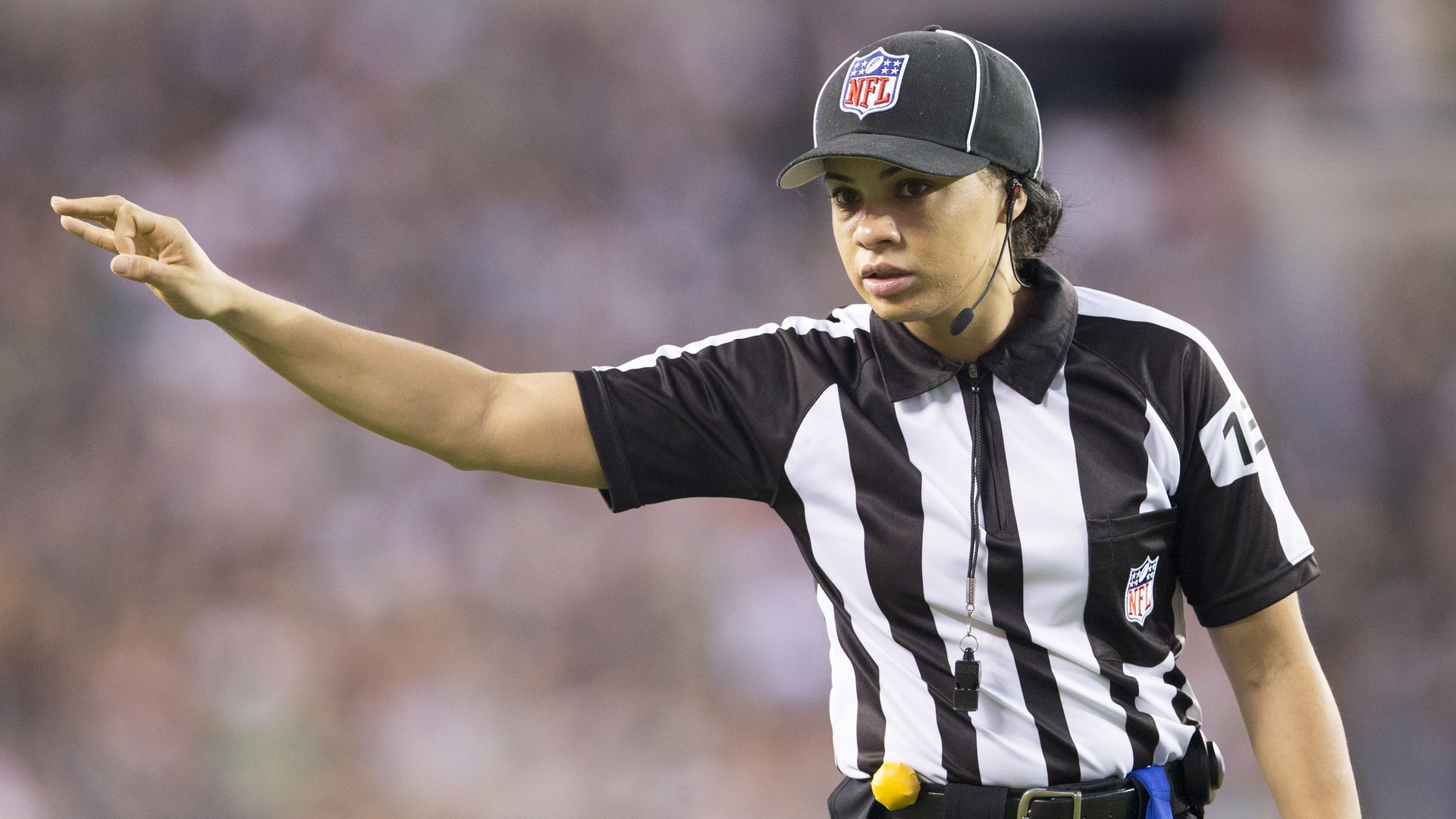Photo of Maia Chaka in uniform as game official on the field