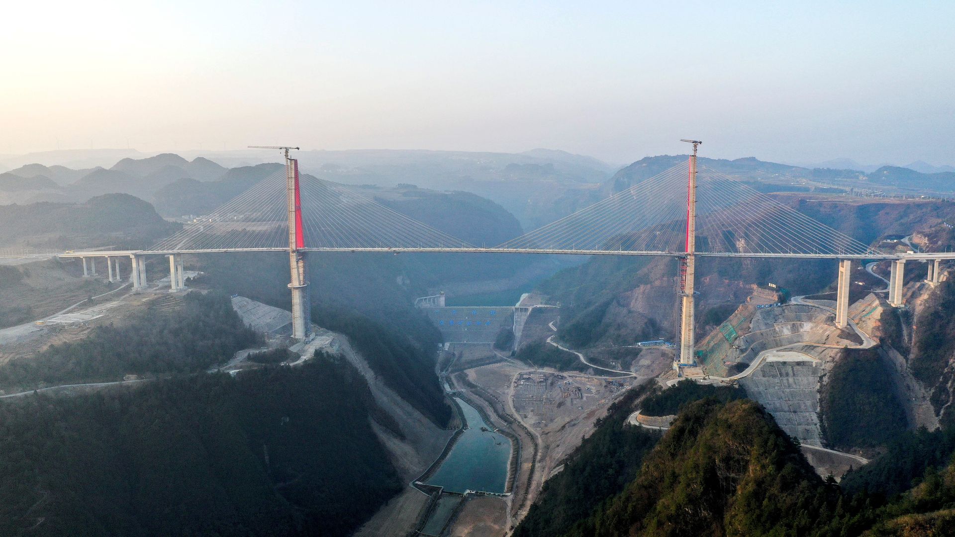 This aerial photo taken on Jan. 29, 2023 shows the Longlihe Bridge in Longli County, southwest China's Guizhou Province.