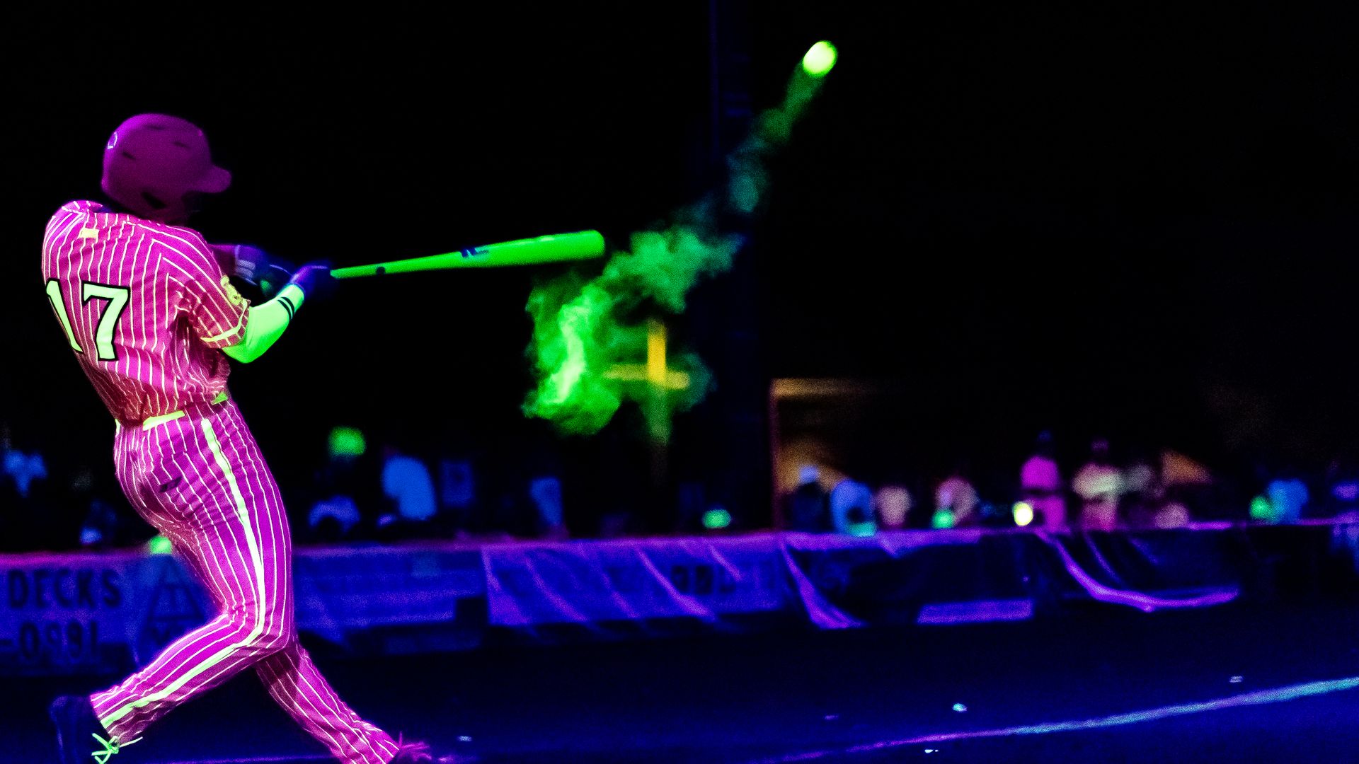 a glow in the dark baseball player, bat and ball - pink and neon green