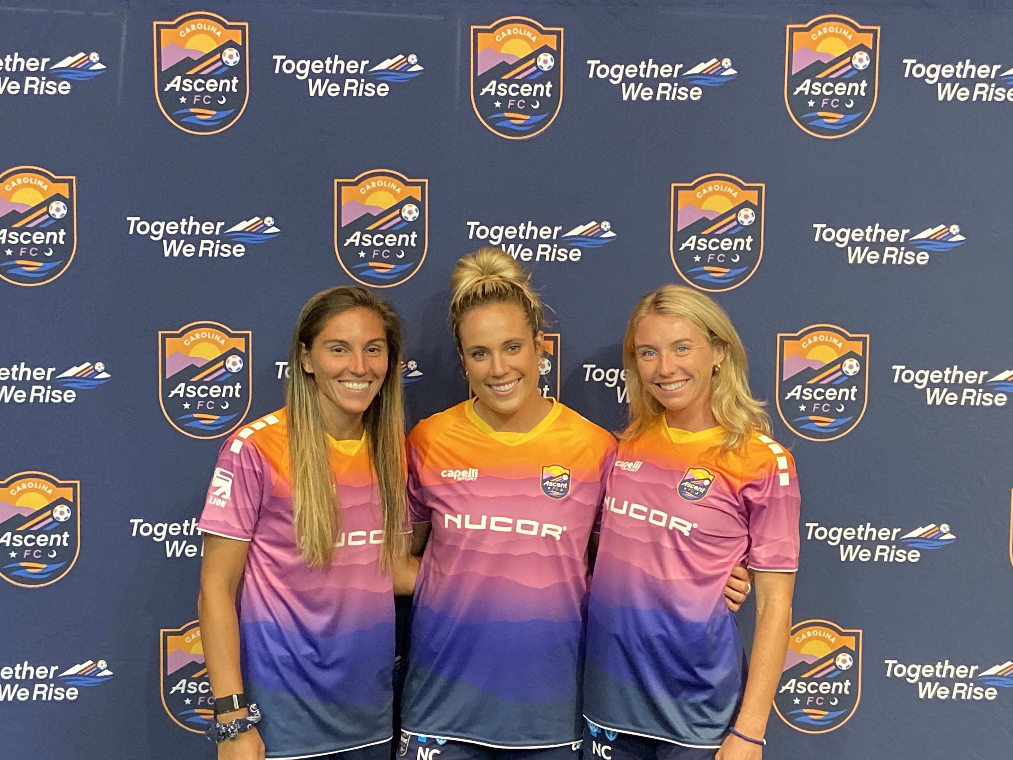 three women pose for photo