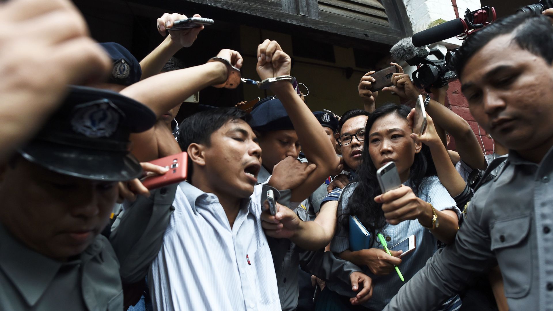 Reuters journalist carried out in handcuffs