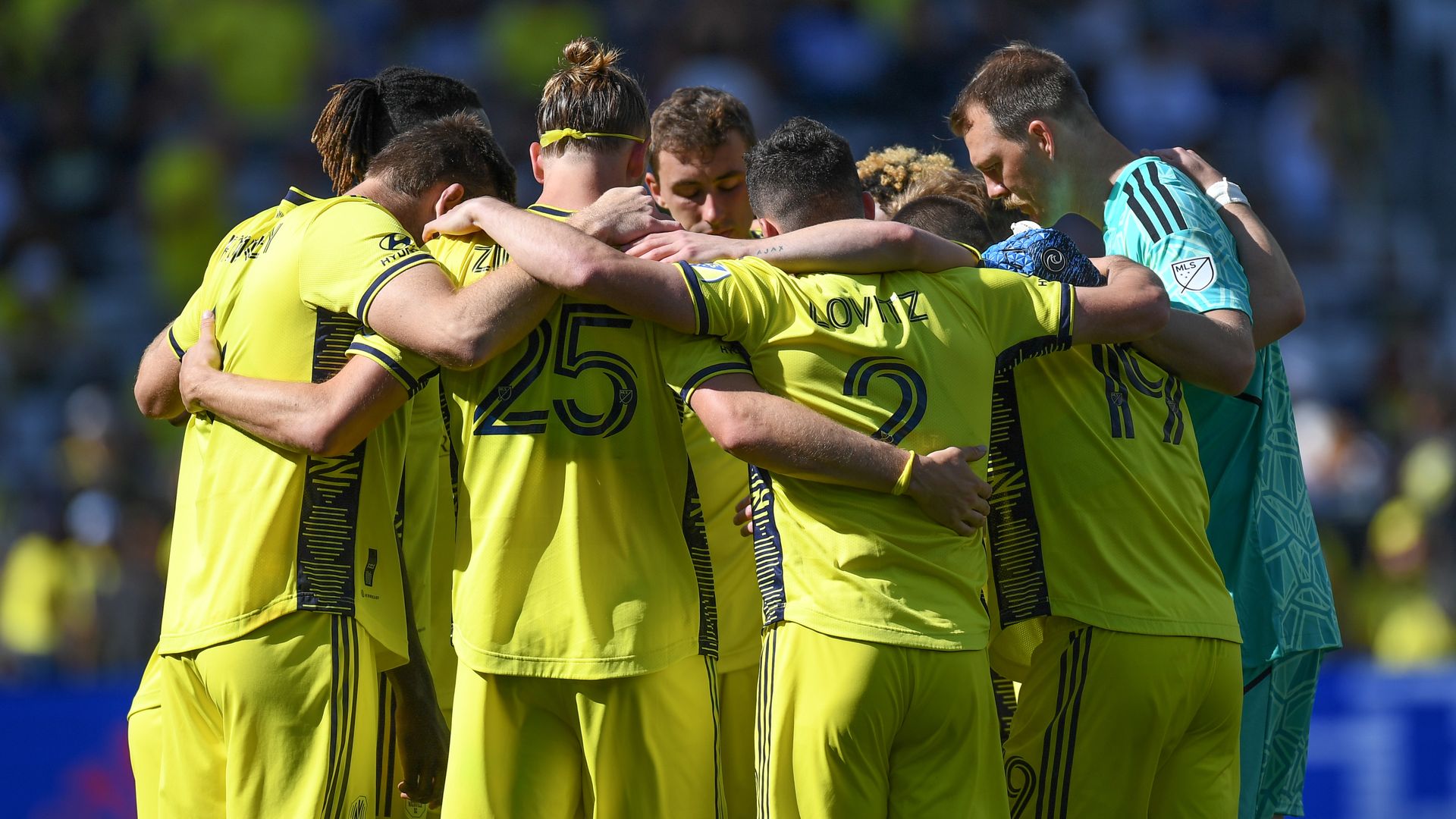 Nashville SC players huddled before gameplay.