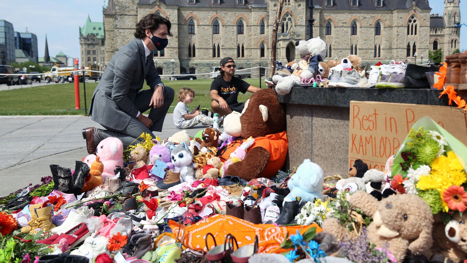 Canadian Prime Minister Justin Trudeau visits the makeshift memorial for indigenous children whose remains were found at a boarding school in British Columbia