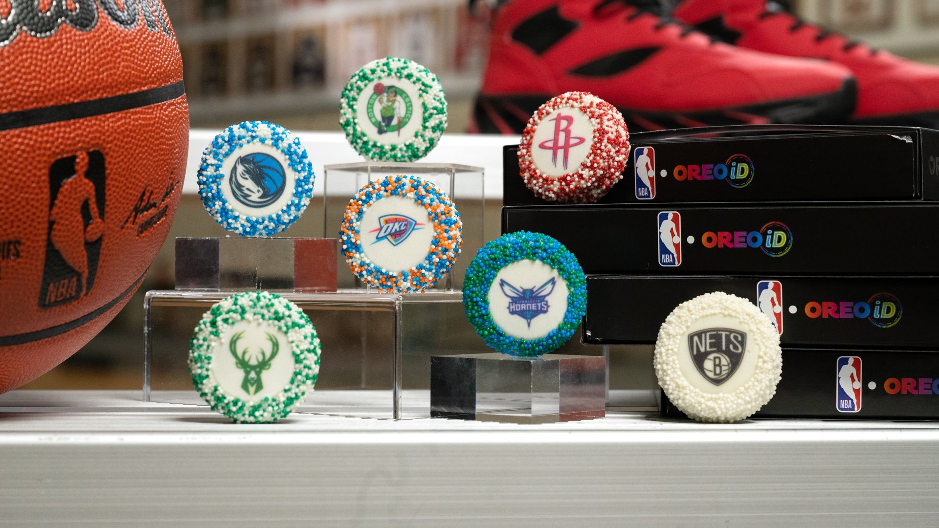 Several sprinkle-covered cookies next to a basketball