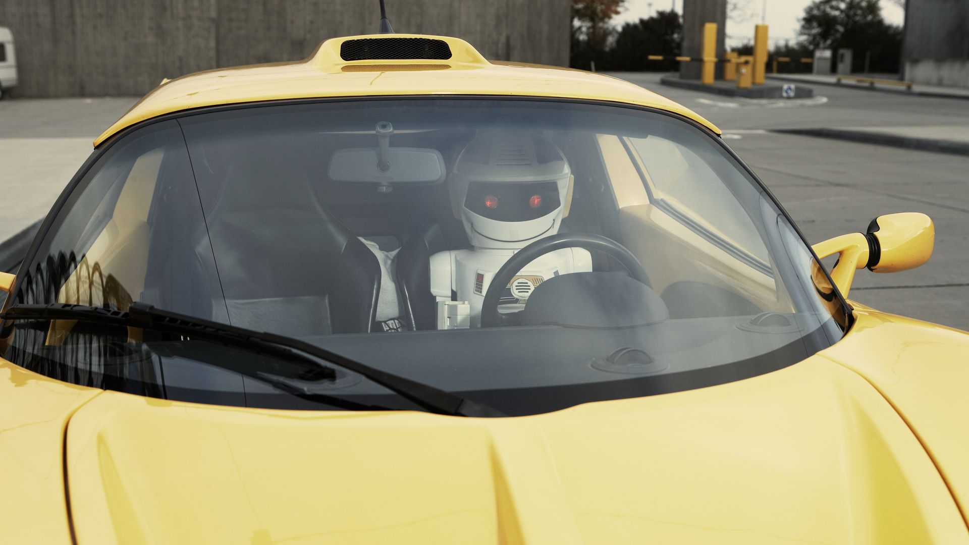 A robot driving a car