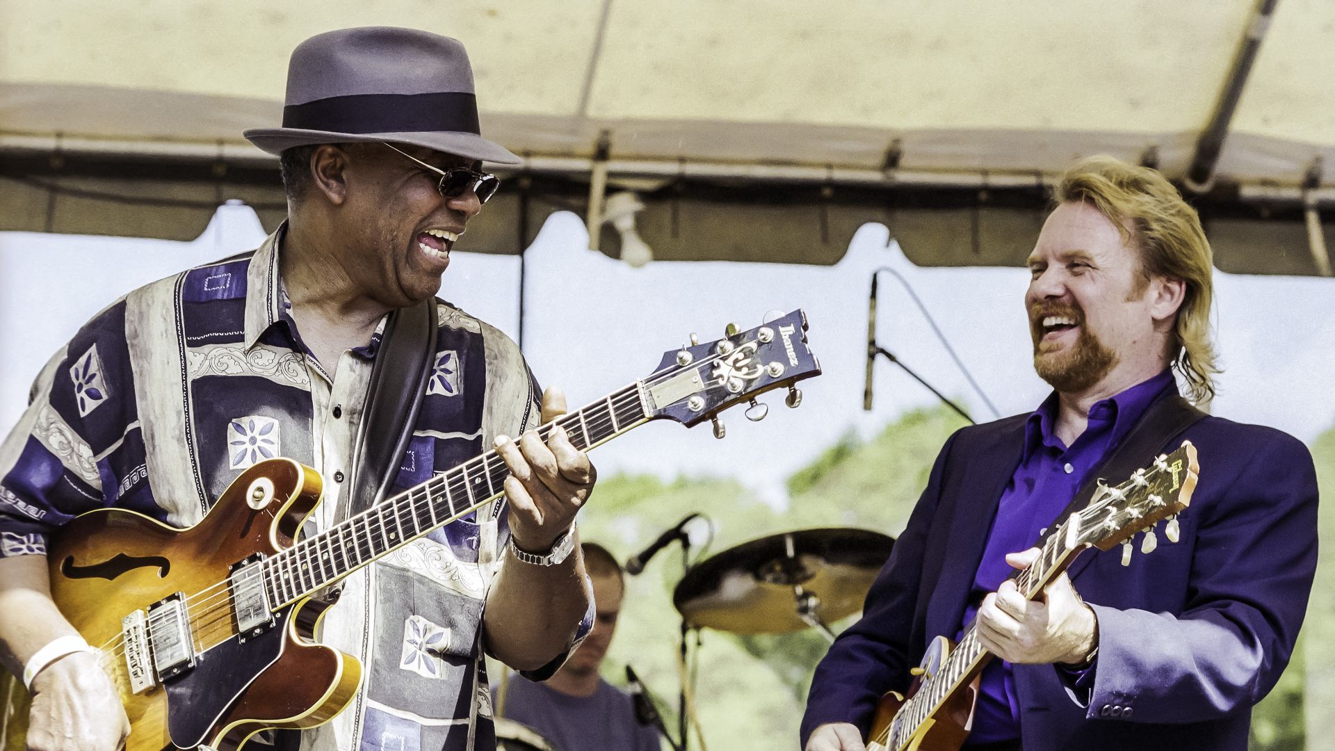 W.C. Clark, left, playing music.