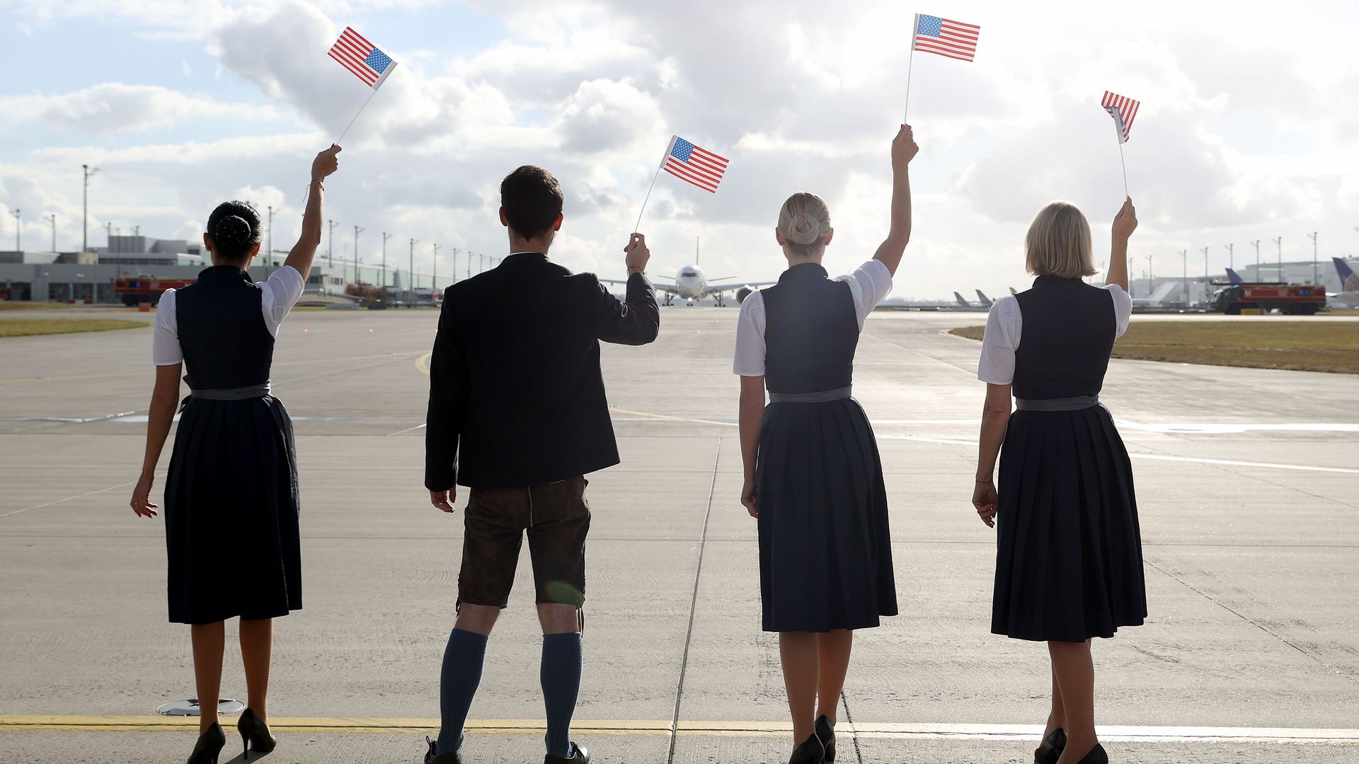 Lufthansa crew waving American flags