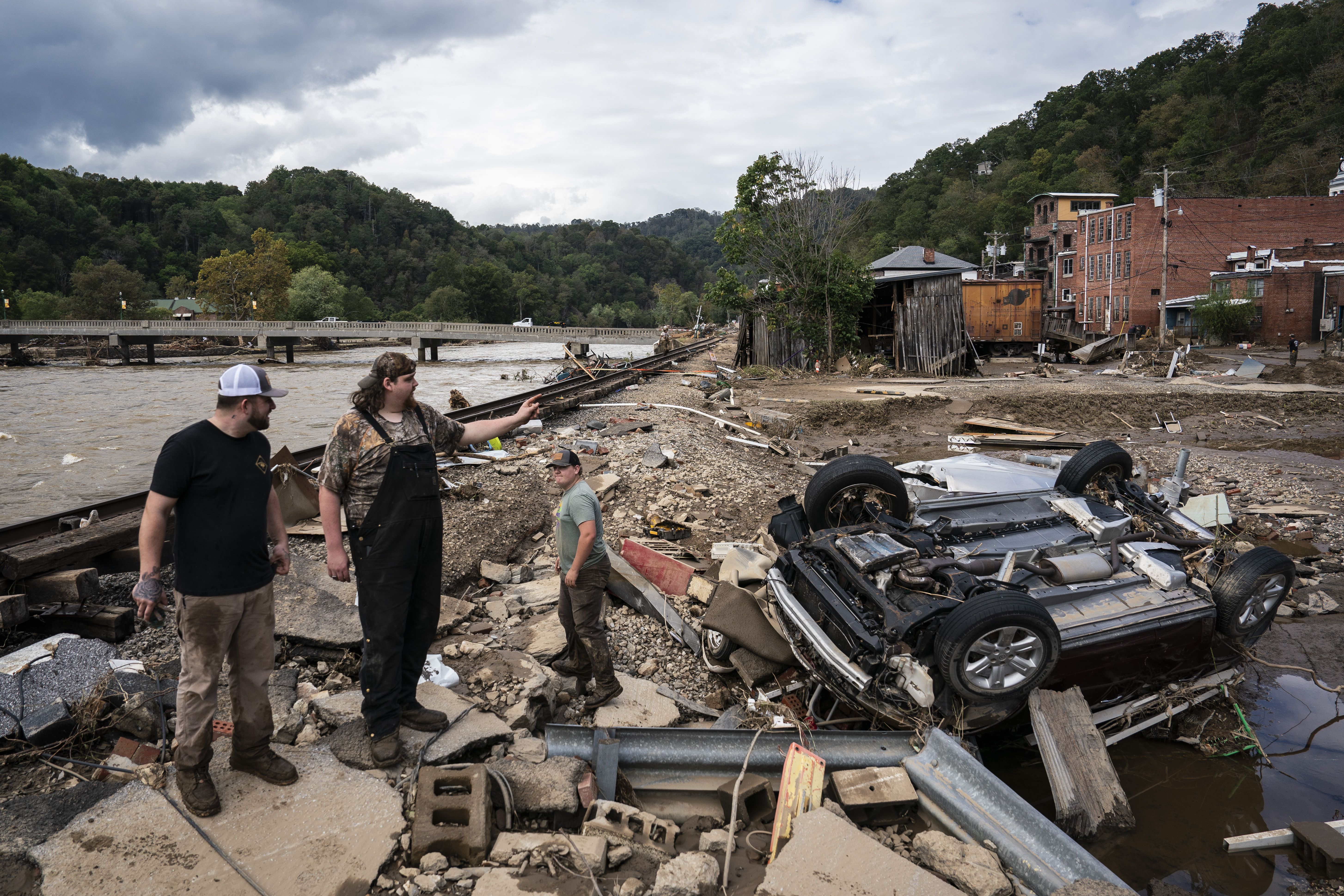 a car turned over in the streets of Marshall after Tropical Storm Helene