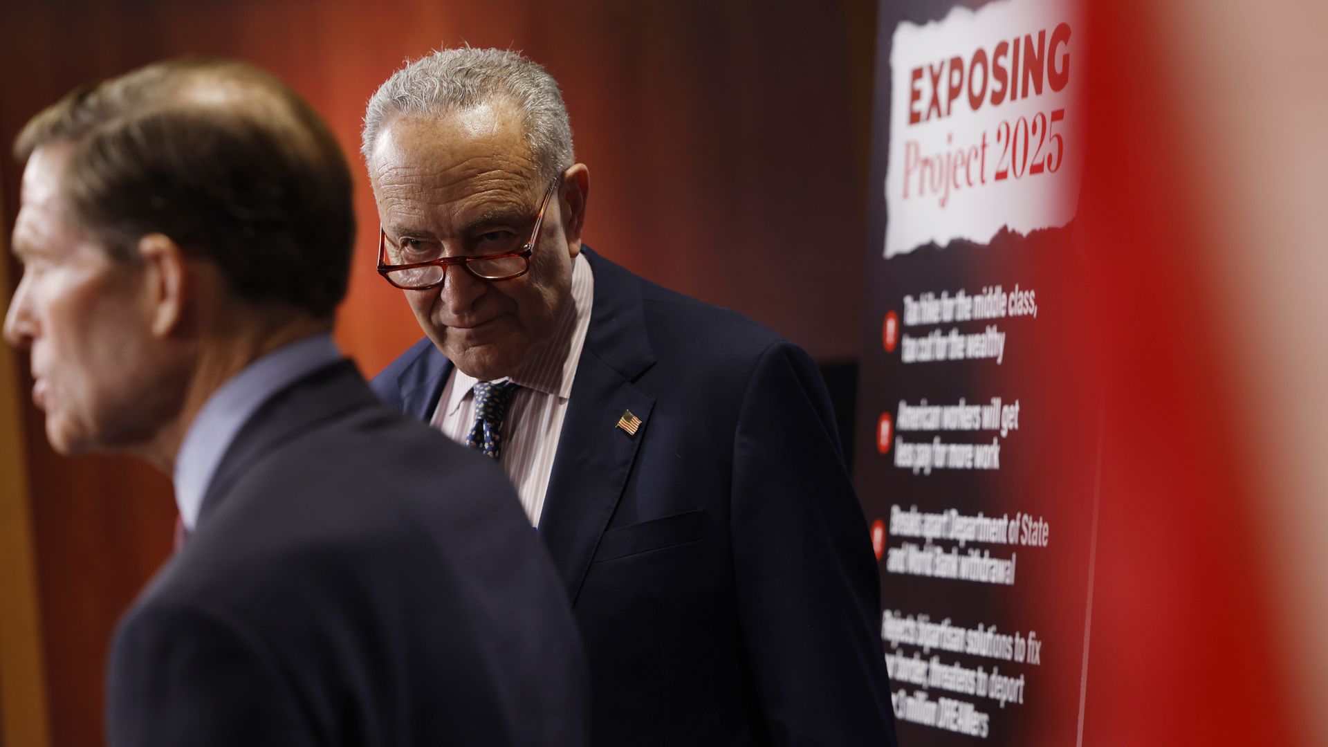 Senate Majority Leader Chuck Schumer (D-NY) listens as Sen. Richard Blumenthal (D-CT) speaks during a news conference on "Project 2025" at the U.S. Capitol Building on September 19, 2024 in Washington, DC. 