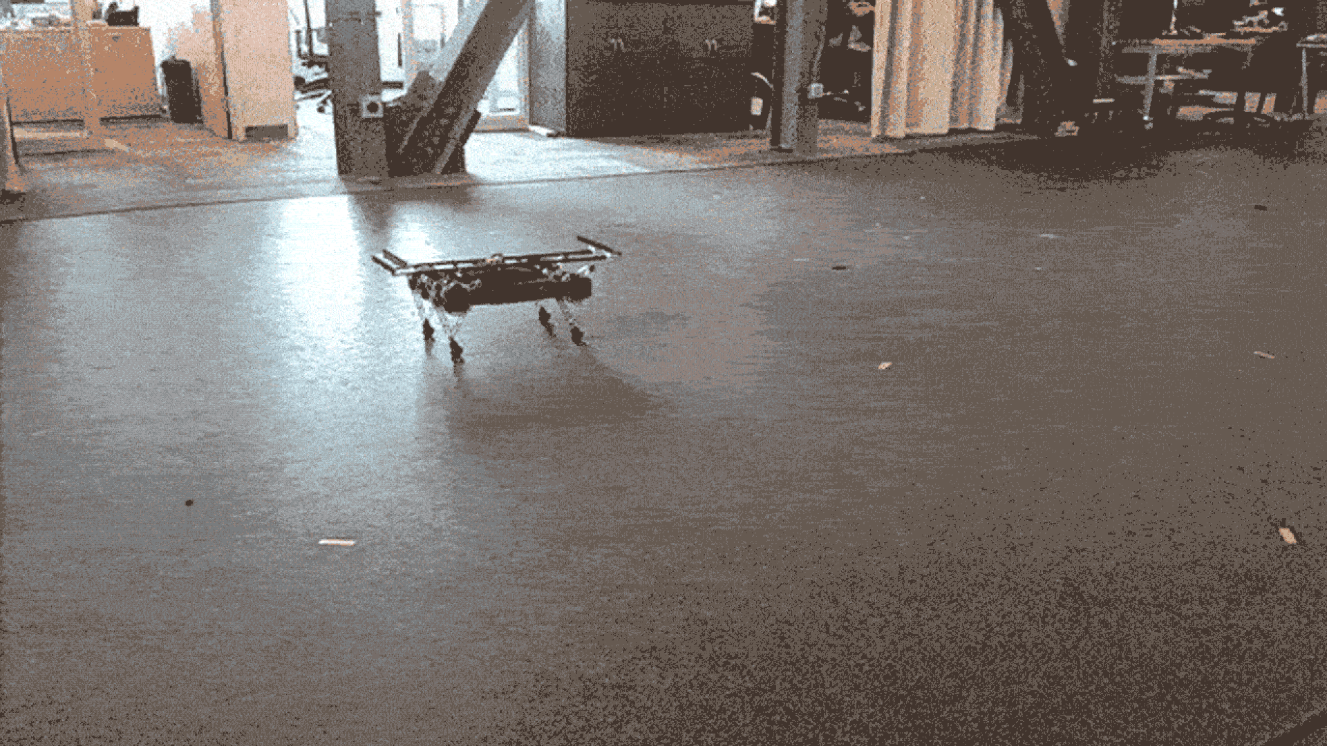 Miniature robot bouncing between its front and hind legs.