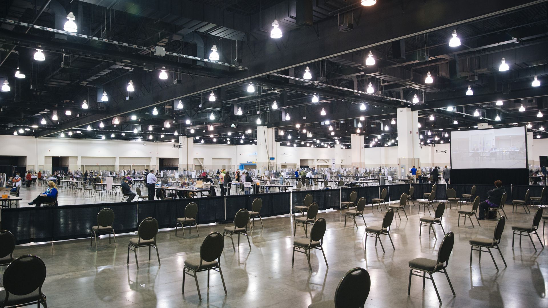Election workers and official observers work to perform a recount of Milwaukee Countys results at the Wisconsin Center.