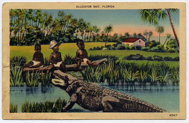 Vintage postcard titled "ALLIGATOR BAIT, FLORIDA" showing three Black children sitting on a log over water with an alligator below, surrounded by green grass, palm trees, and a white house with red roof.
