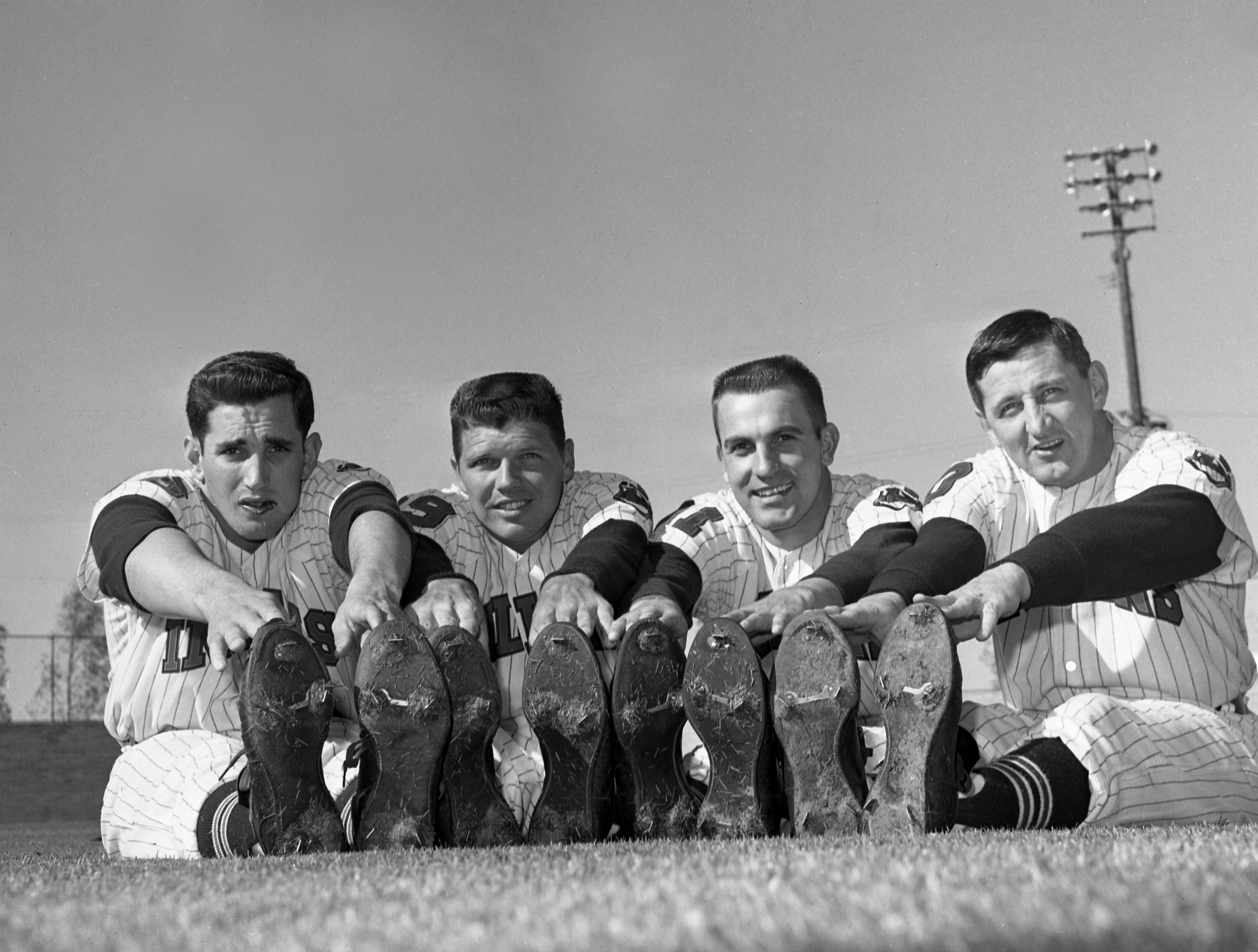 Four Cleveland Indians pitchers stretch during 1962 spring training.
