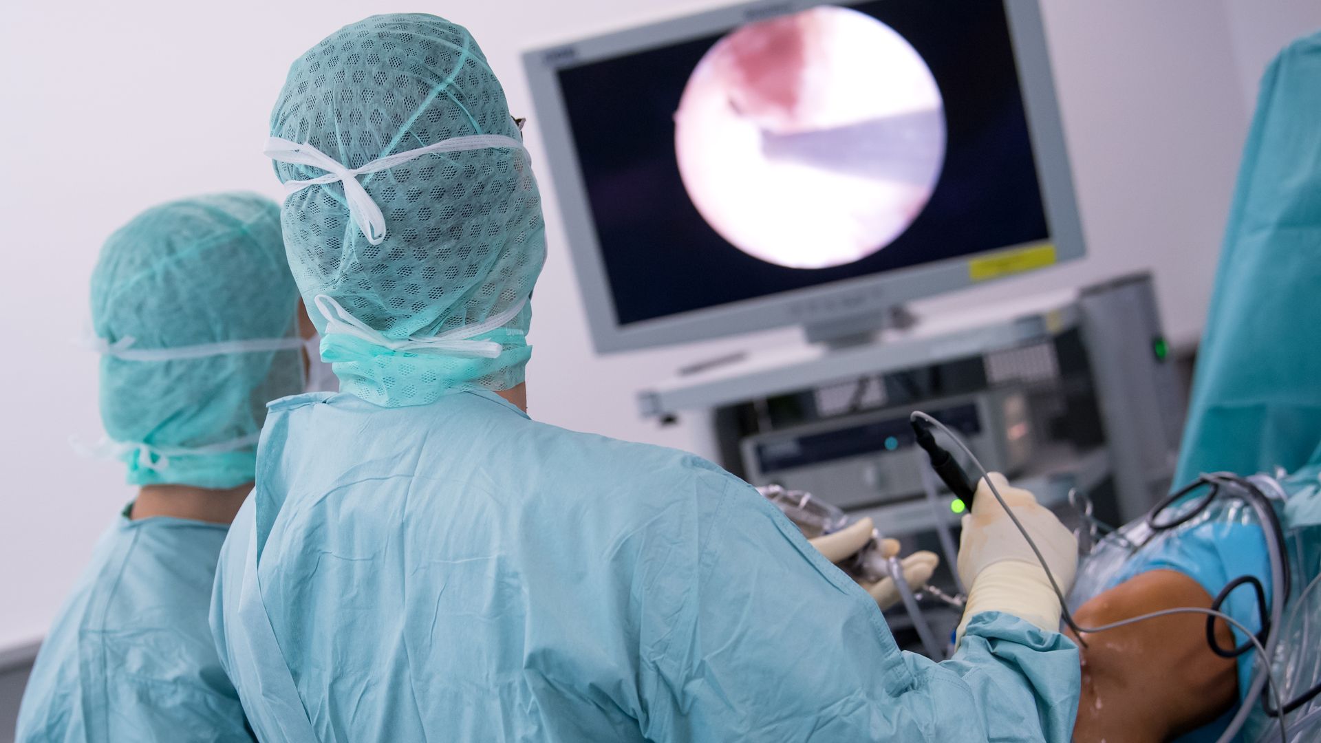 Doctor operating on knee