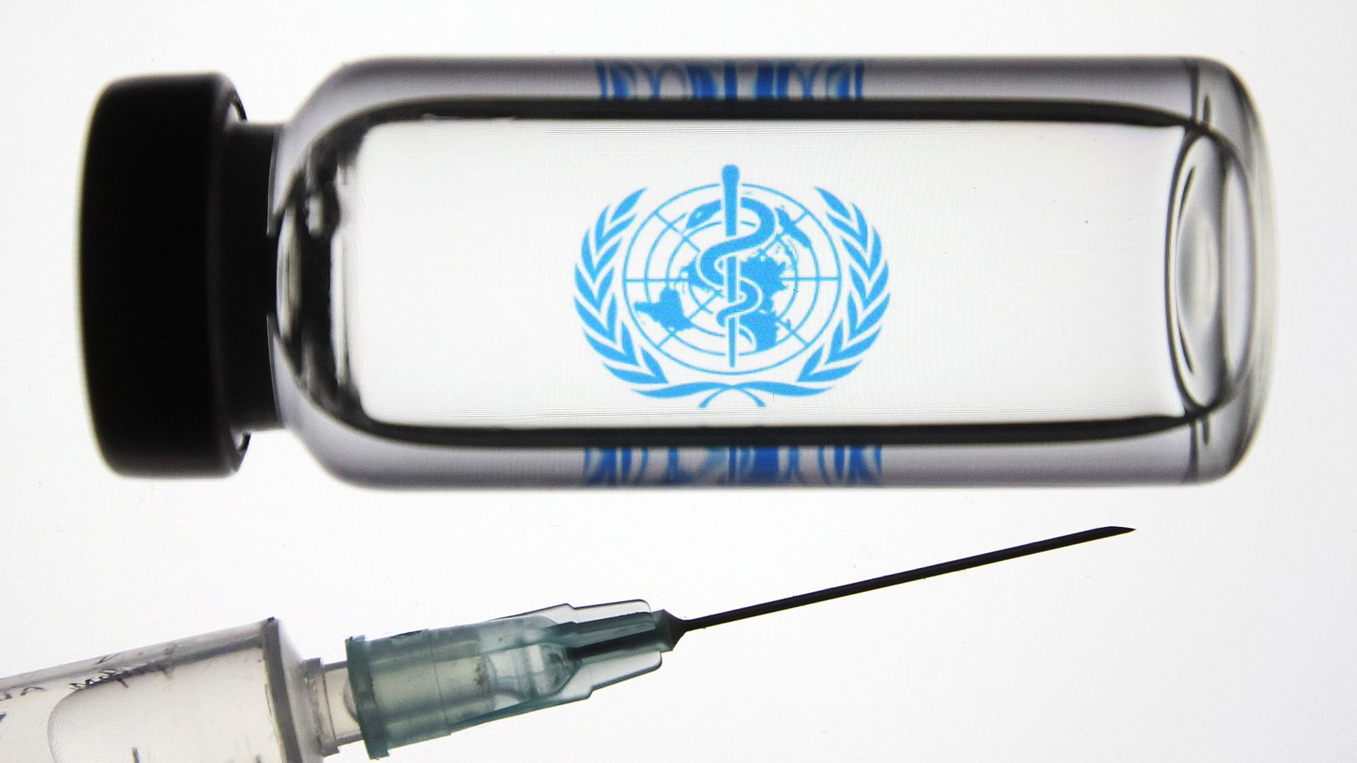Close up of a vial with the WHO logo on it