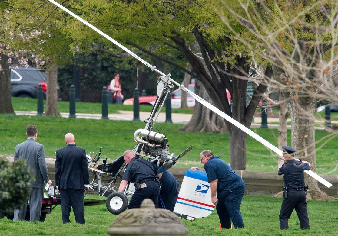 Capitol Hill police officers and other officials Hughes' gyrocopter onto a trailer. 