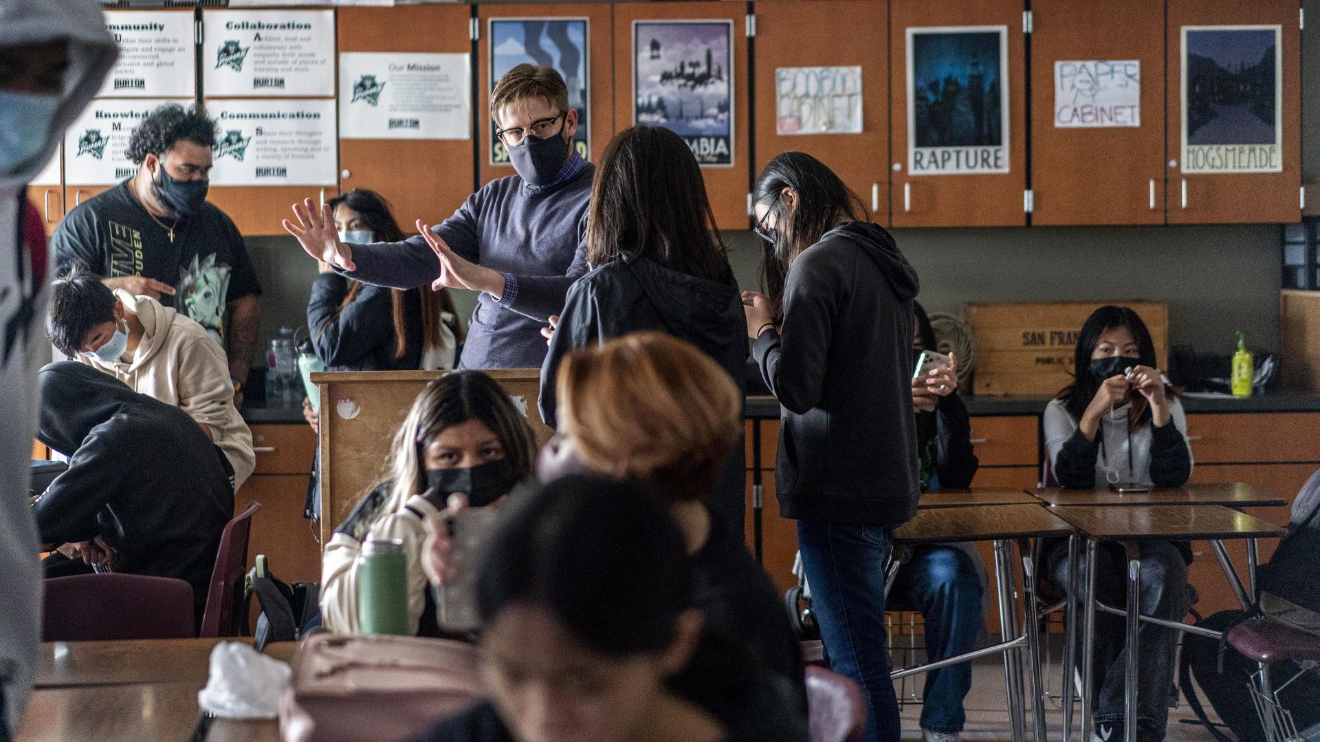 Teacher talking with students