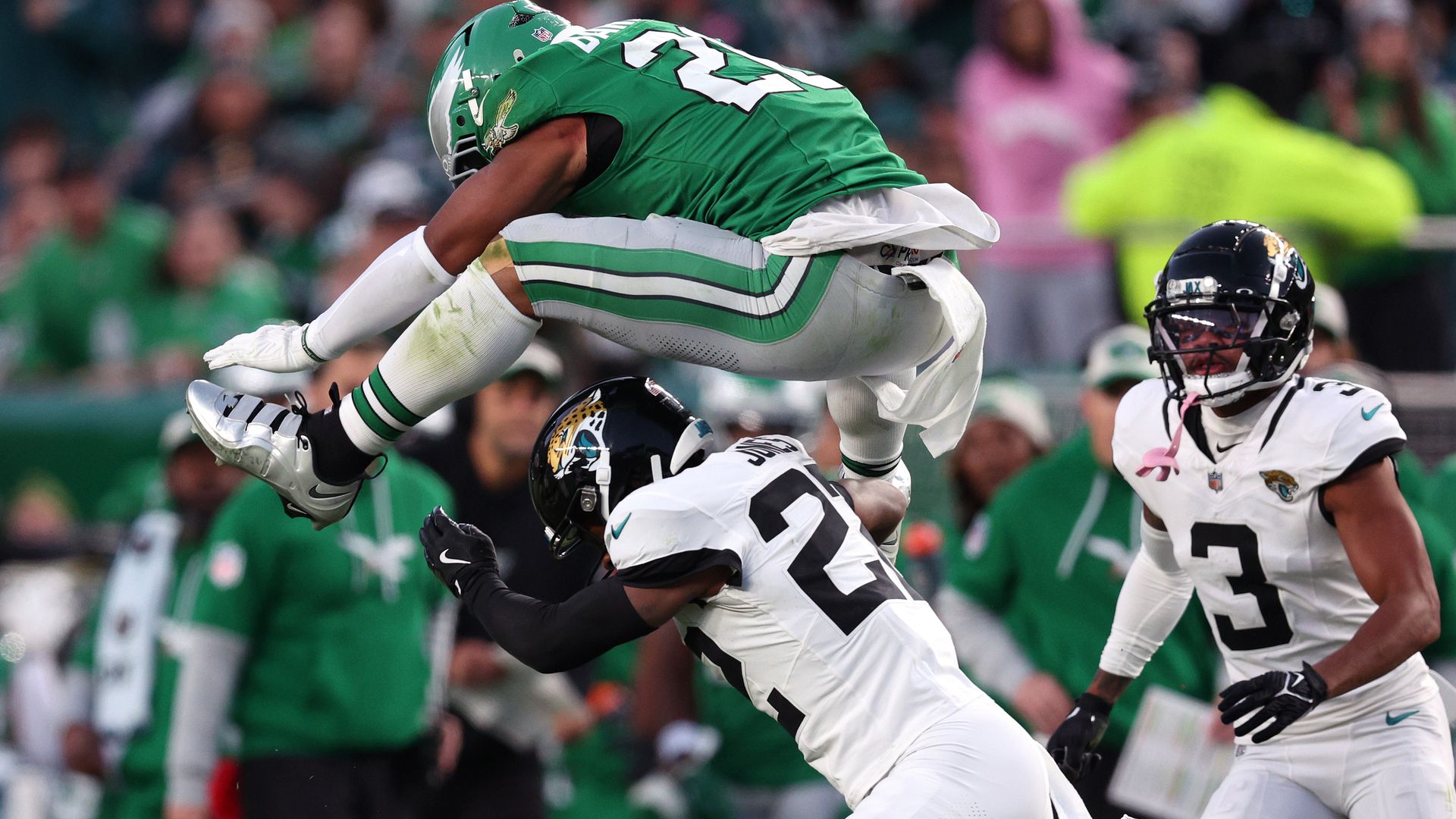 The Eagles' Saquon Barkley hurdles Jacksonville's Jarrian Jones.
