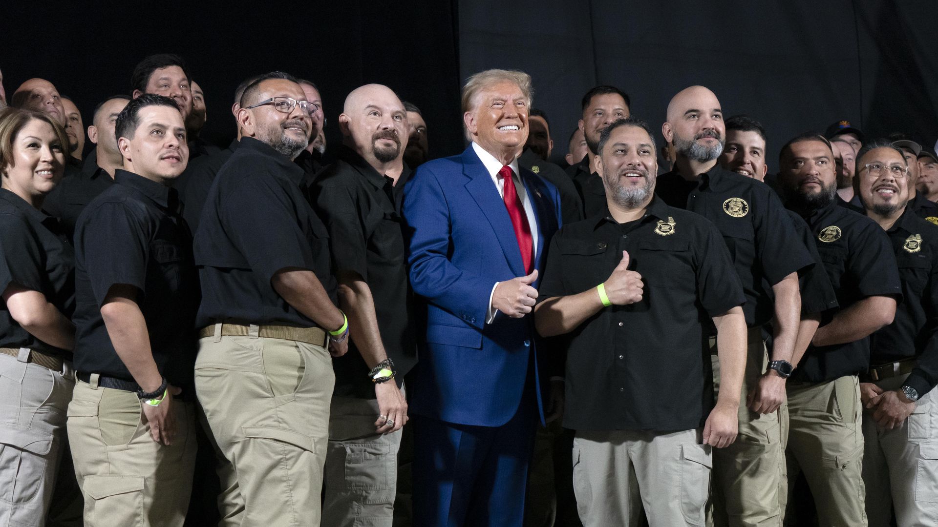 Republican presidential nominee, former President Donald Trump poses for a picture with the National Border Patrol Council during a campaign rally at Findlay Toyota Center on October 13, 2024 in Prescott Valley, Arizona. 