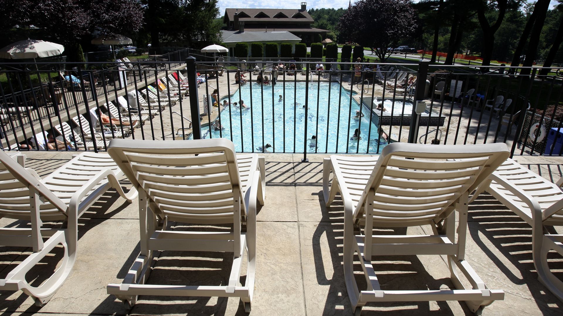 FOXBOROUGH, MA - AUGUST 13: More and more people want the experience of camping without actually camping, like at the upscale campgrounds like Normandy Farms in Foxborough. A sunbathing deck over looking one of the pools and jacuzzi. (Photo by Suzanne Kreiter/The Boston Globe via Getty Images)